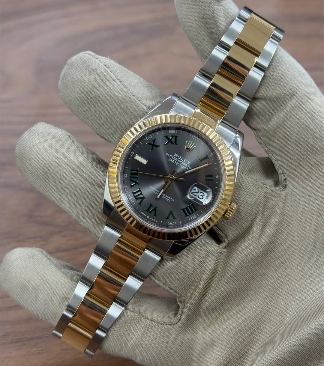 May be an image of wrist watch and text