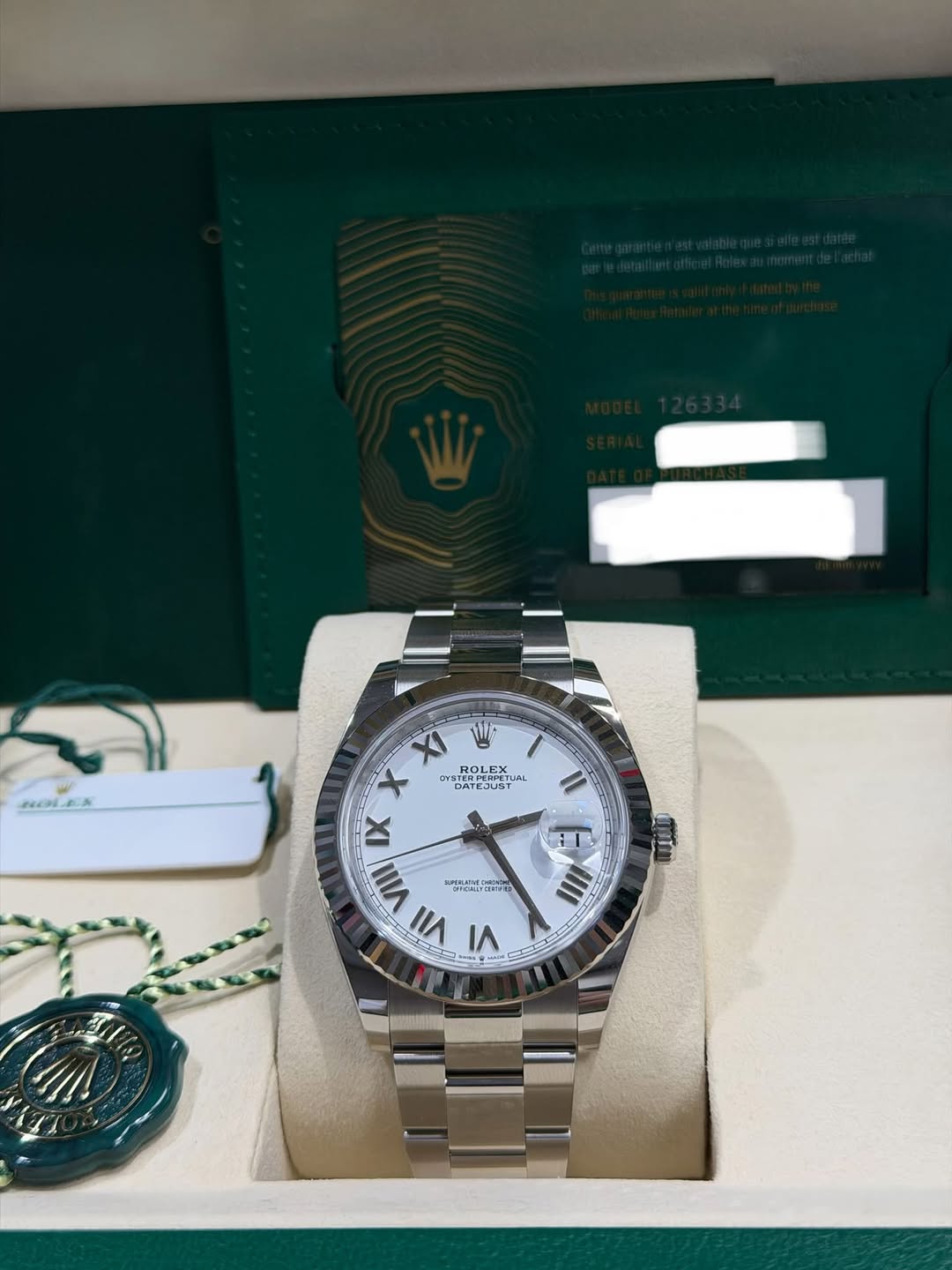 May be an image of wrist watch and text