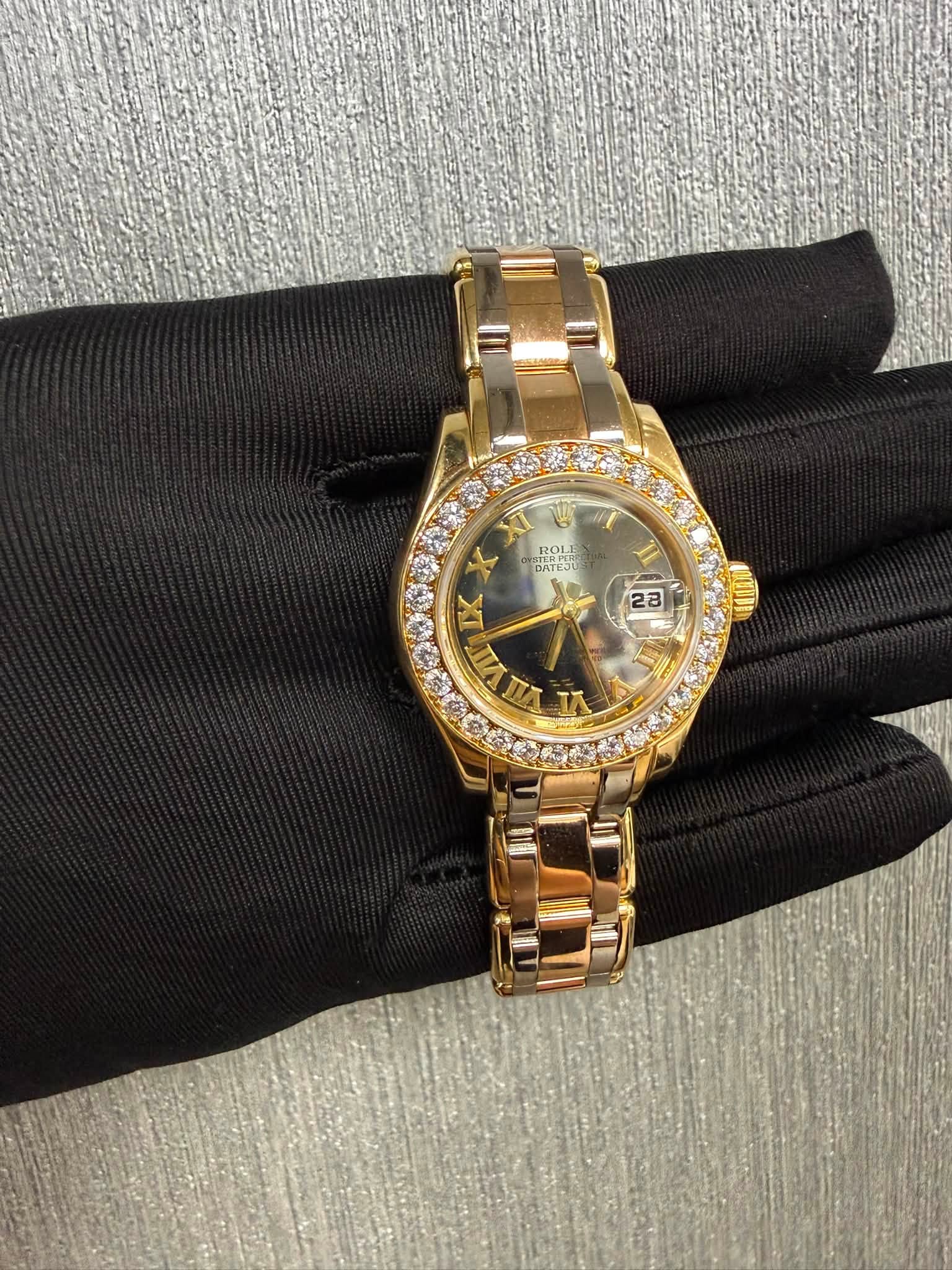 May be an image of wrist watch and text