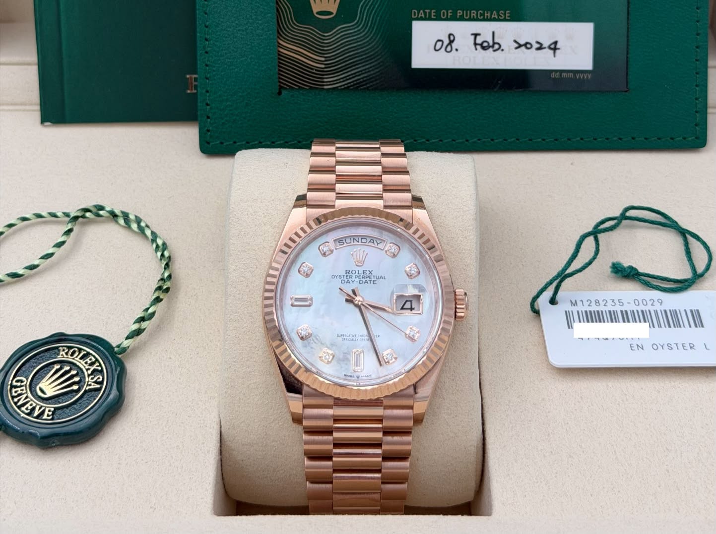 May be an image of wrist watch and text
