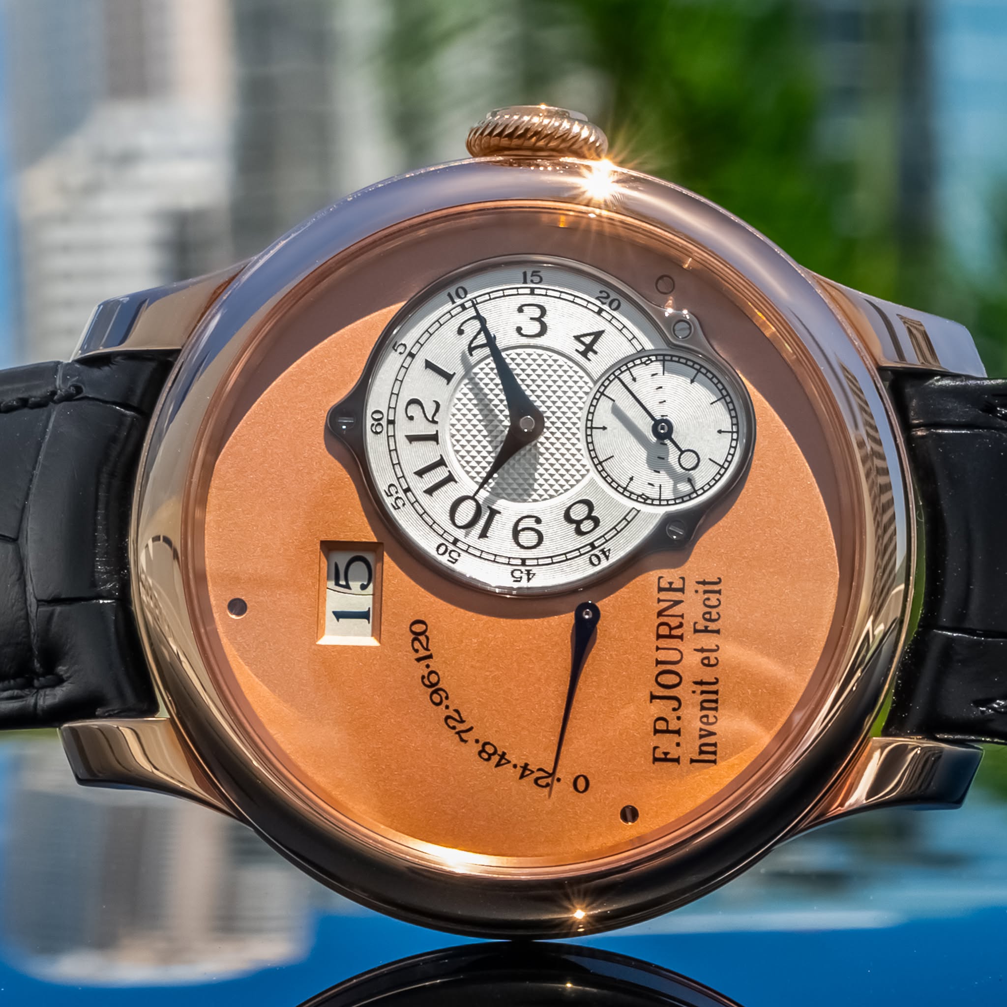 May be an image of wrist watch and text