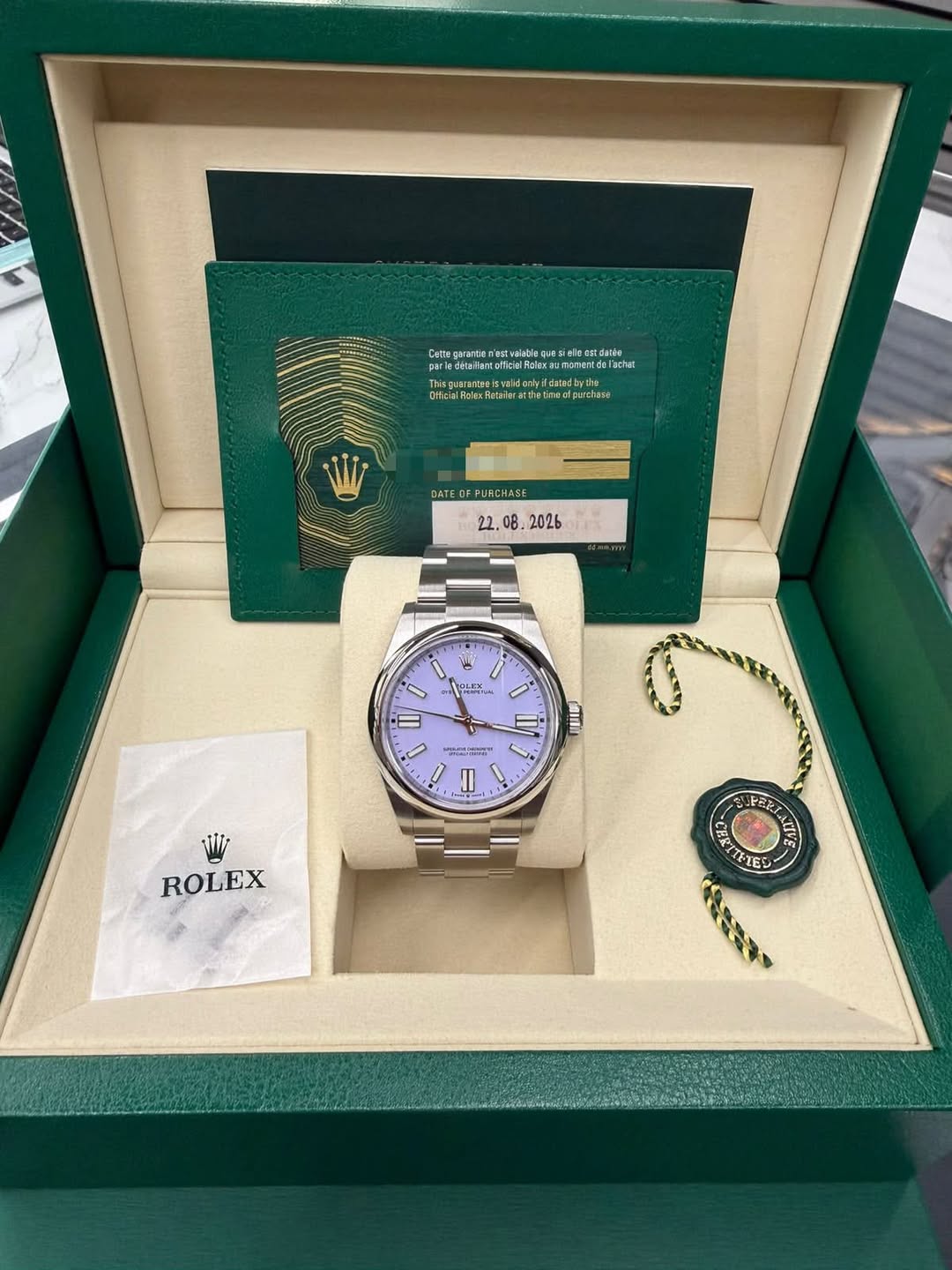 May be an image of wrist watch and text