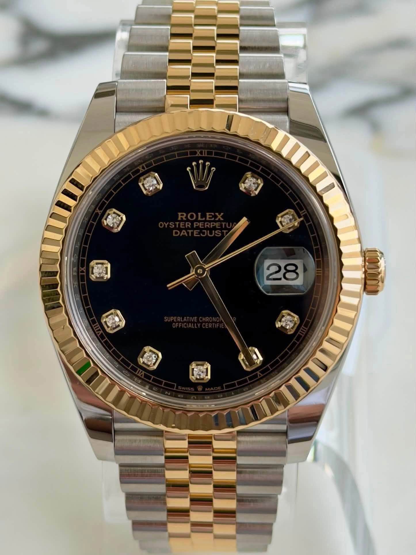 May be an image of wrist watch and text