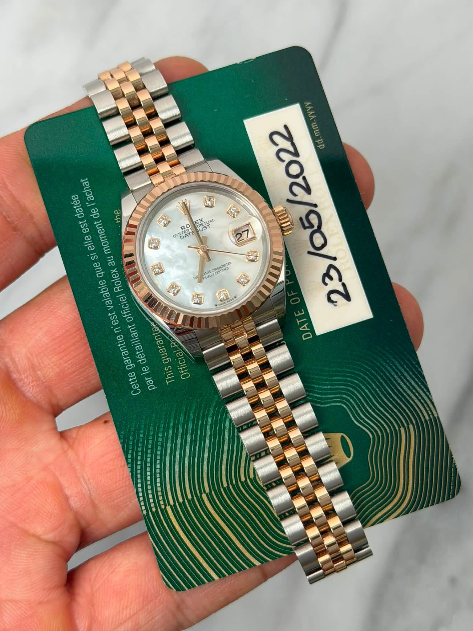 May be an image of wrist watch and text that says '2022 d.mm.yyy S 1 านมา 3a 1 肉 DAT E POM cTB eииe achat datée de ل te est elle moment que ли au valable est officiel Rolex…