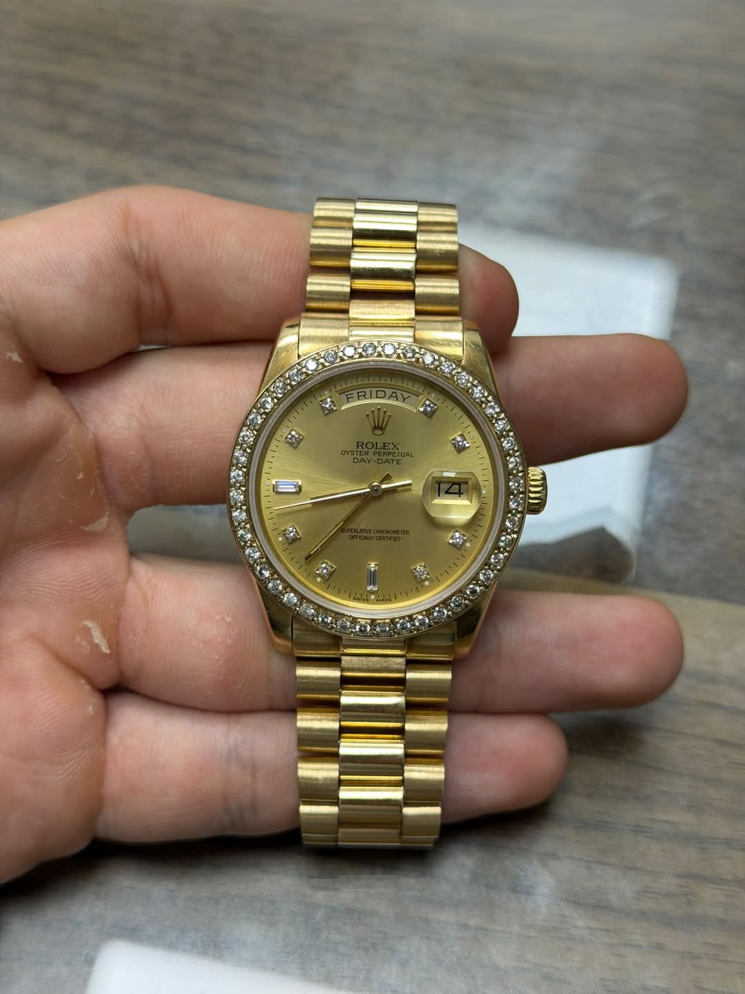 May be an image of wrist watch and text
