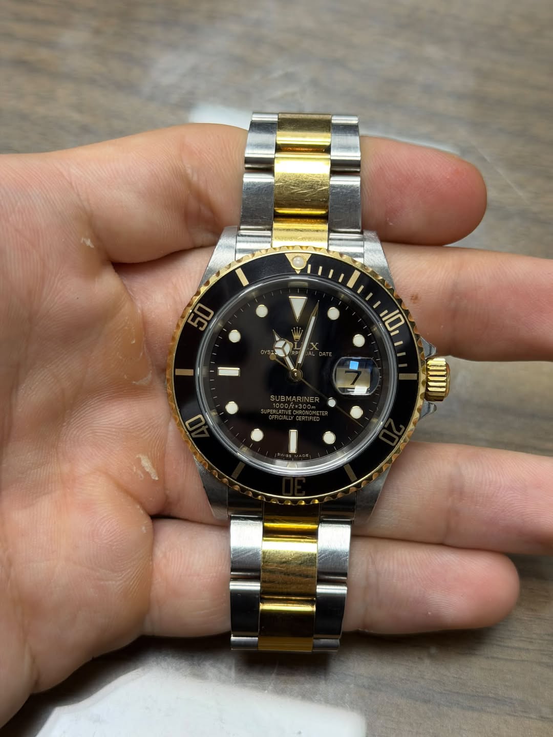 May be an image of wrist watch and text