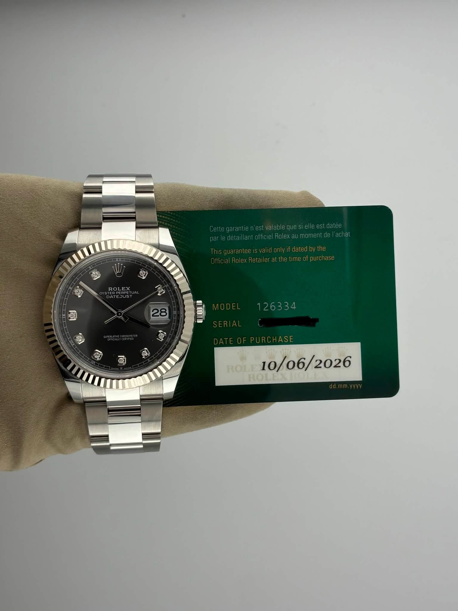May be an image of wrist watch and text