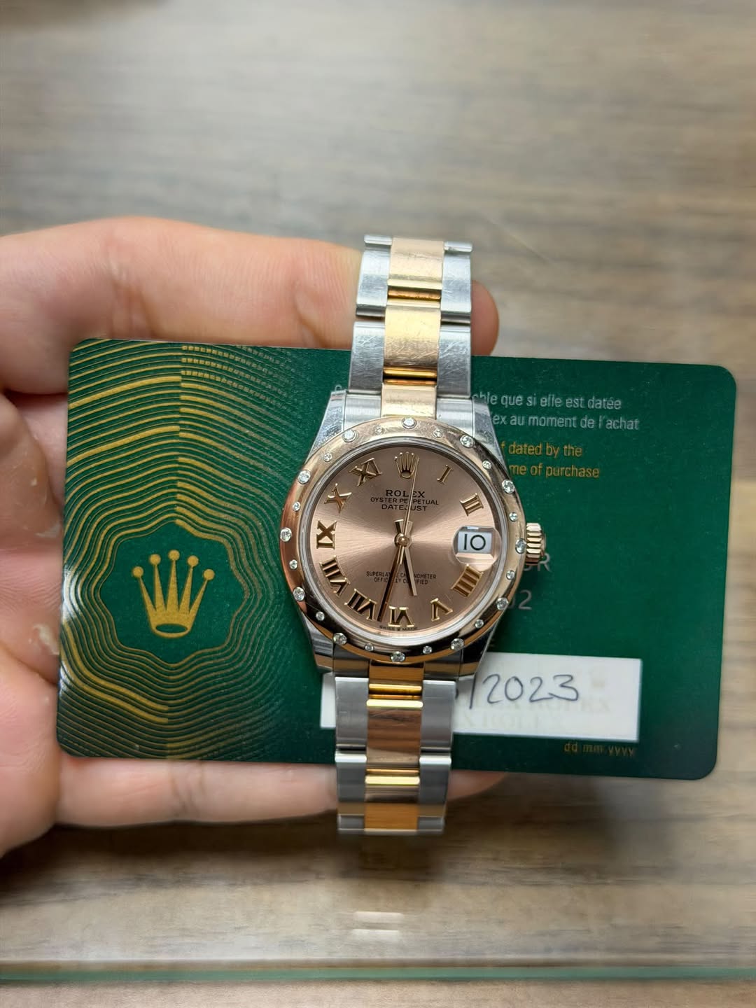 May be an image of wrist watch and text