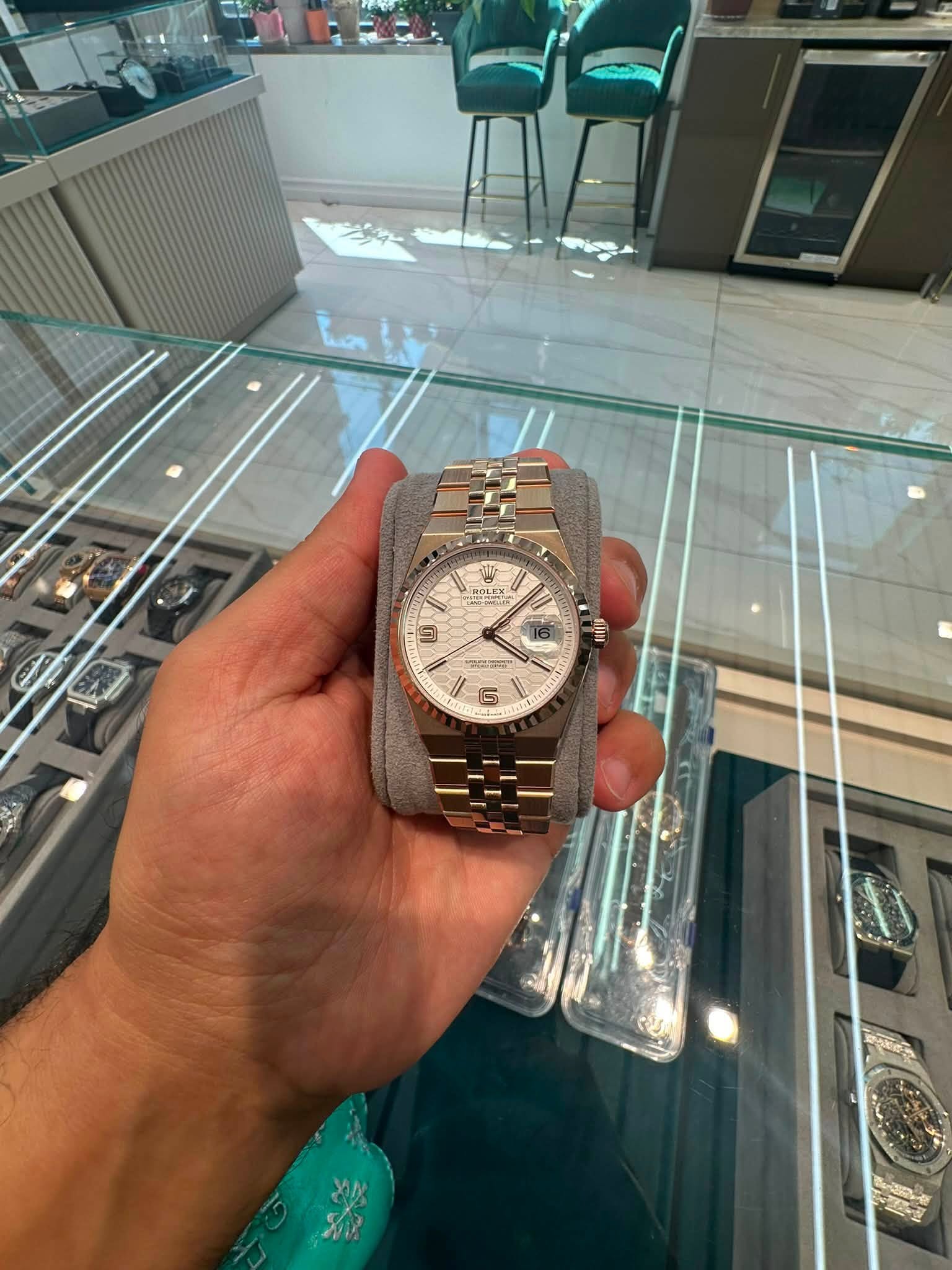 May be an image of wrist watch and text