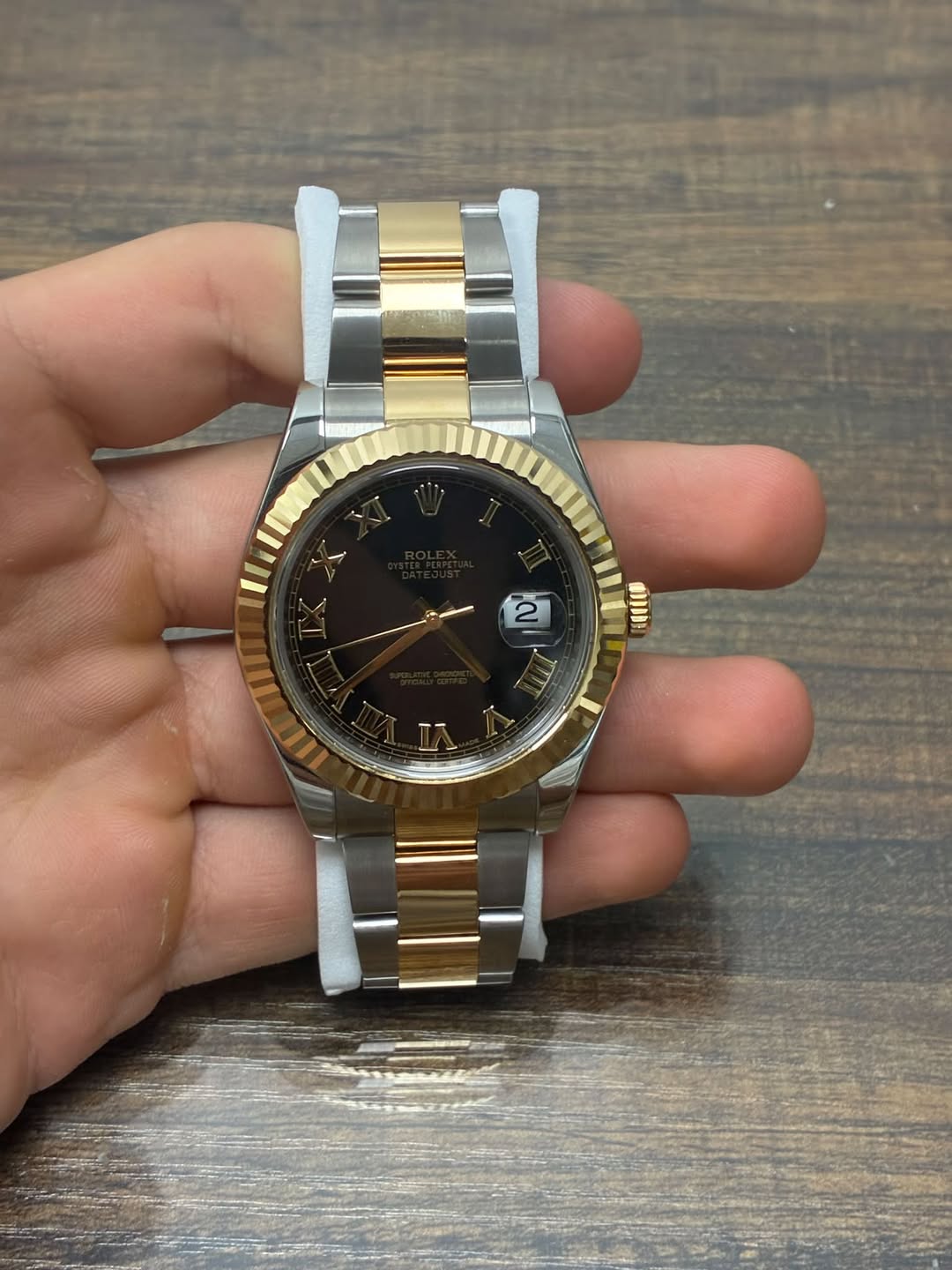 May be an image of wrist watch and text