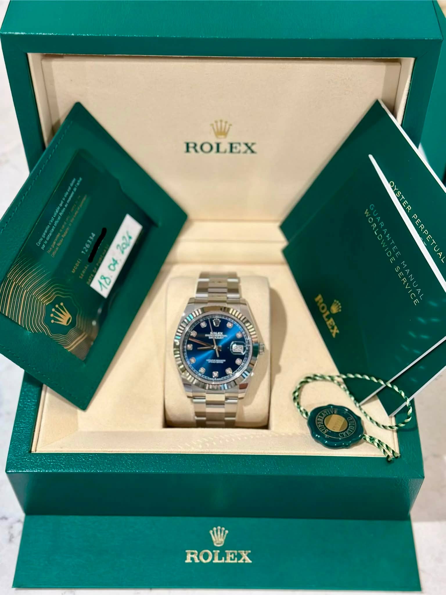 May be an image of wrist watch and text that says 'Vi ROLEX . OYSTER PERPETUAL PERPETUA SERVICE MANUA II1 0 ิม w/ 3O ROLEX'