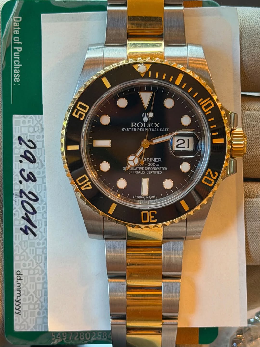 May be an image of wrist watch and text