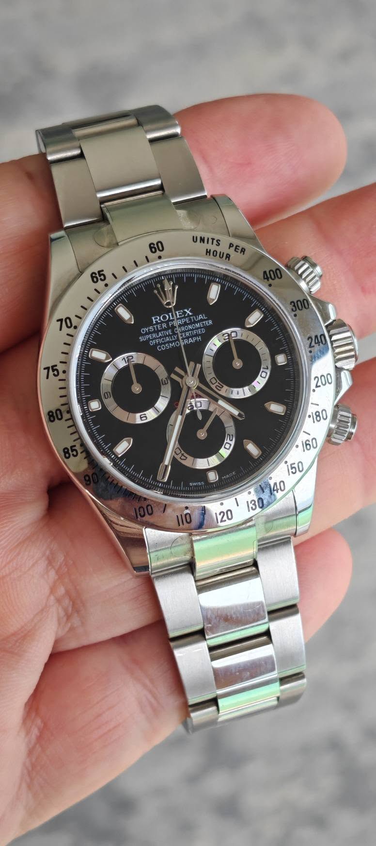 May be an image of wrist watch and text