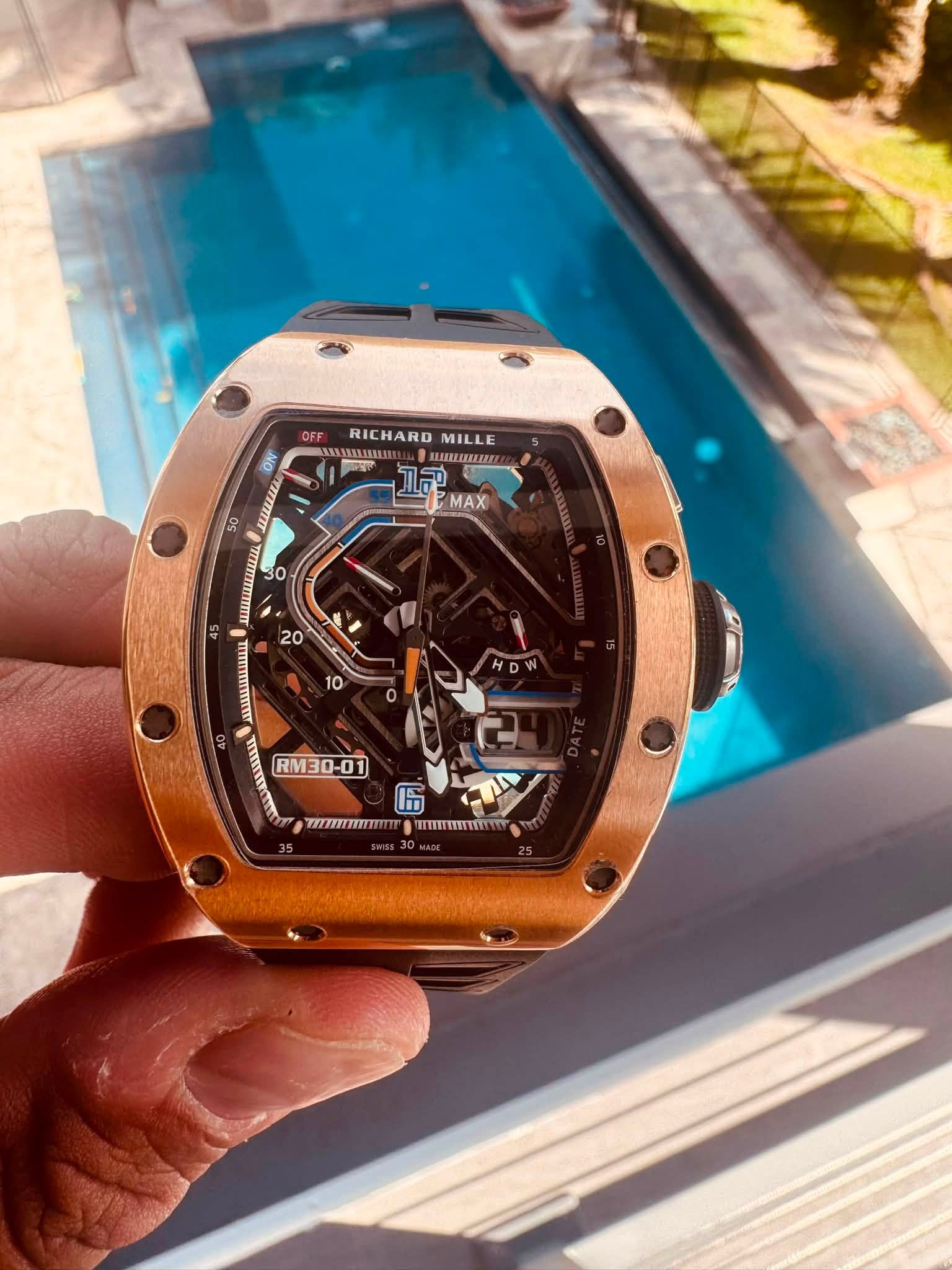 May be an image of wrist watch and text