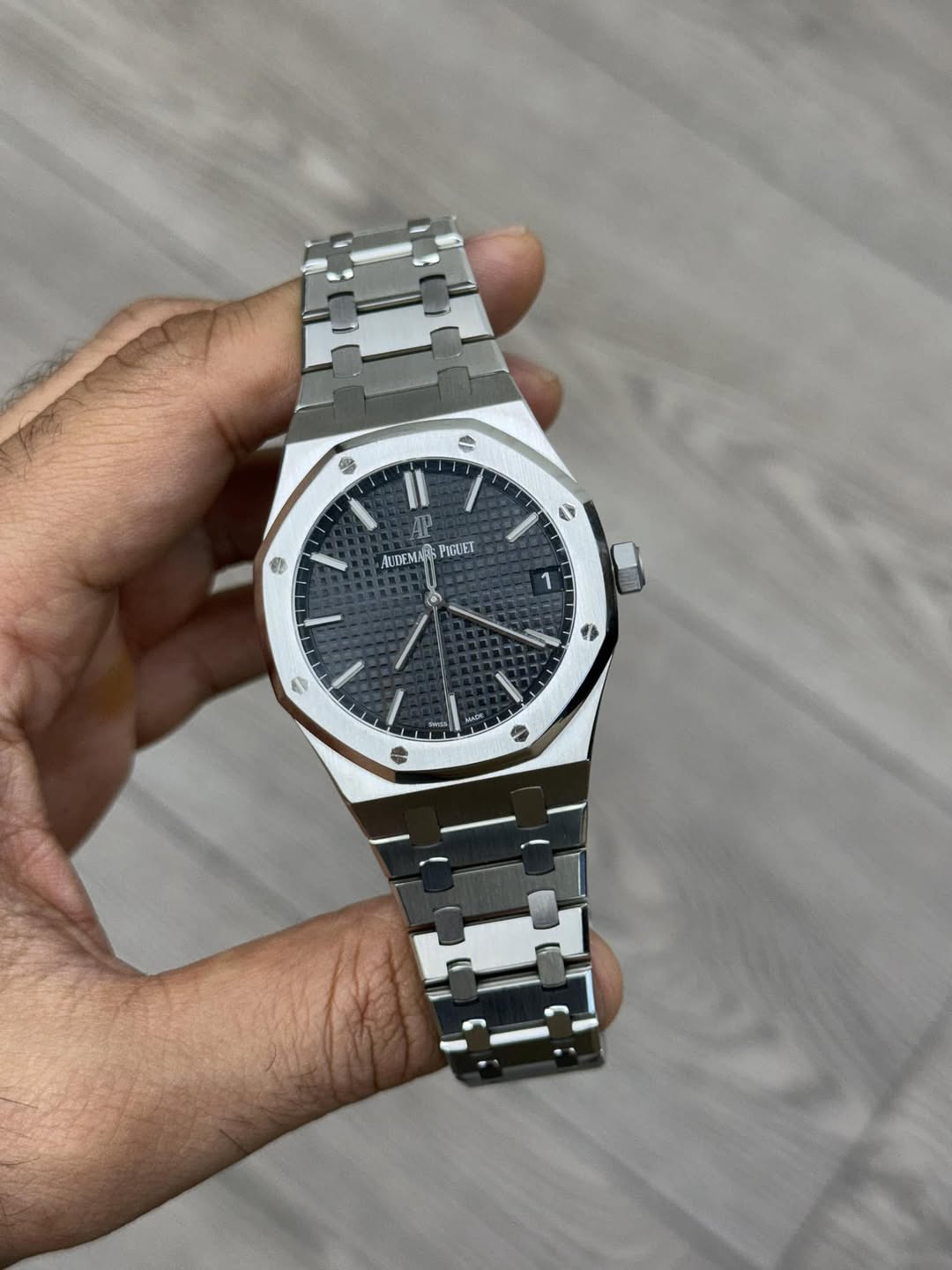 May be an image of wrist watch and text