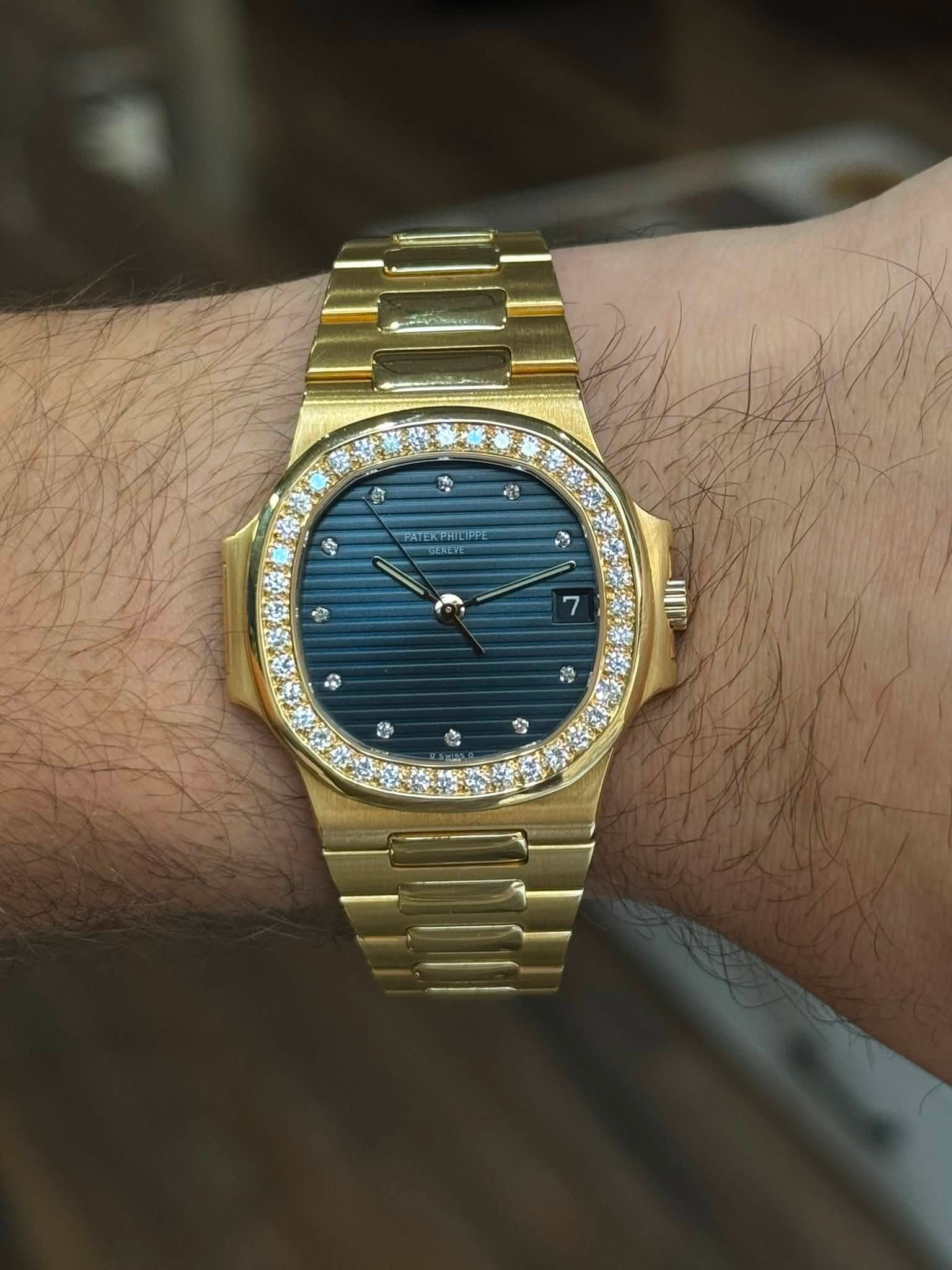 May be an image of wrist watch and text