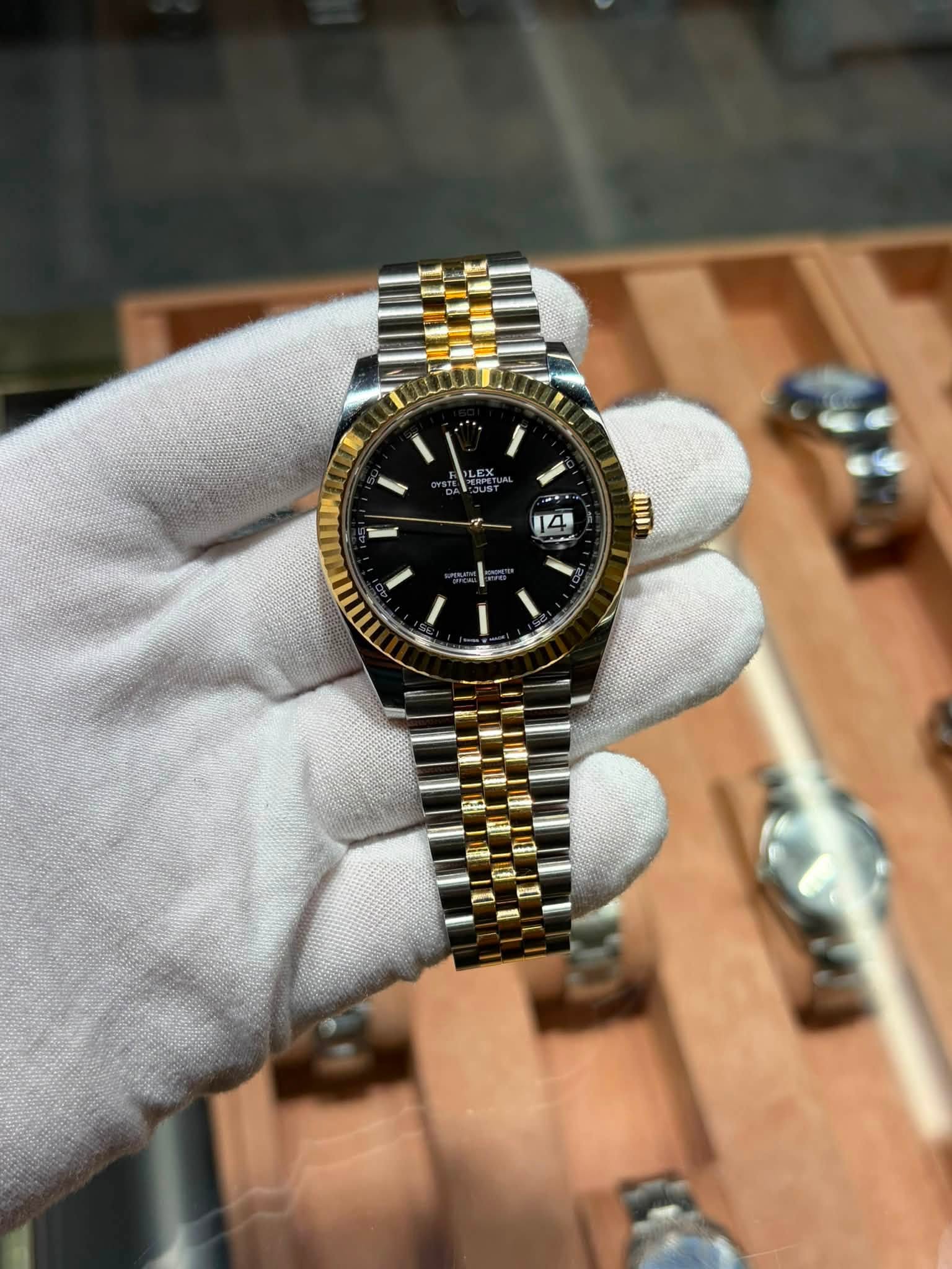 May be an image of wrist watch and text