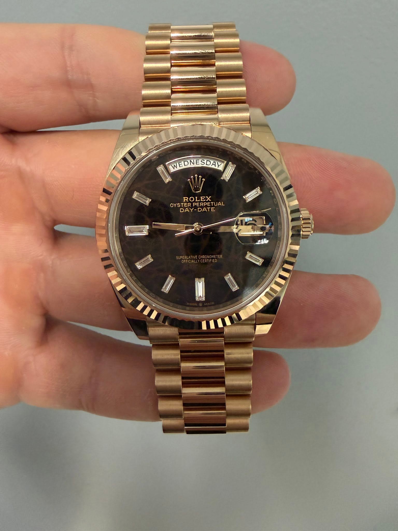 May be an image of wrist watch and text