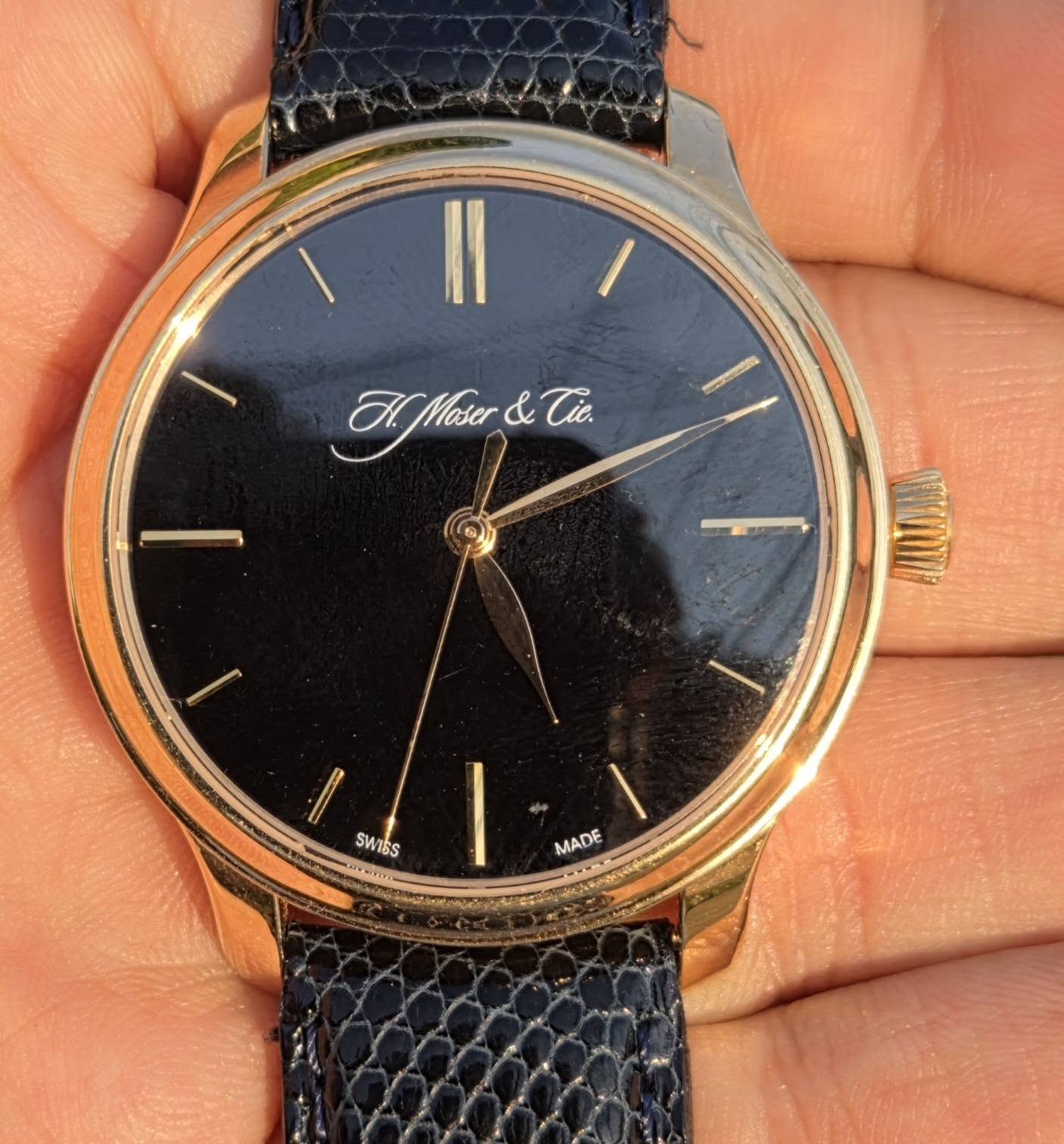May be an image of wrist watch and text