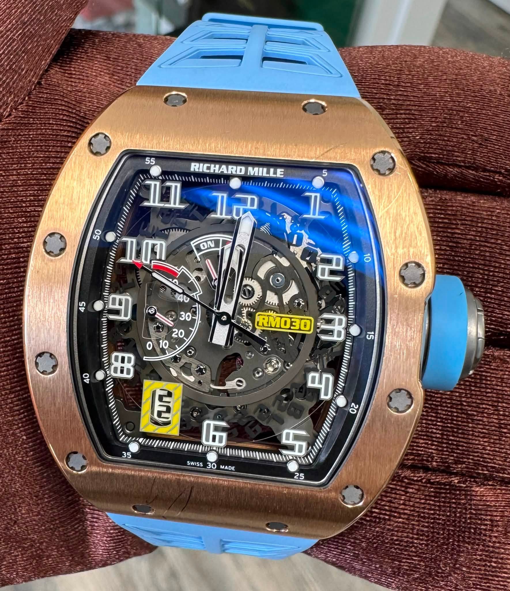 May be an image of wrist watch and text