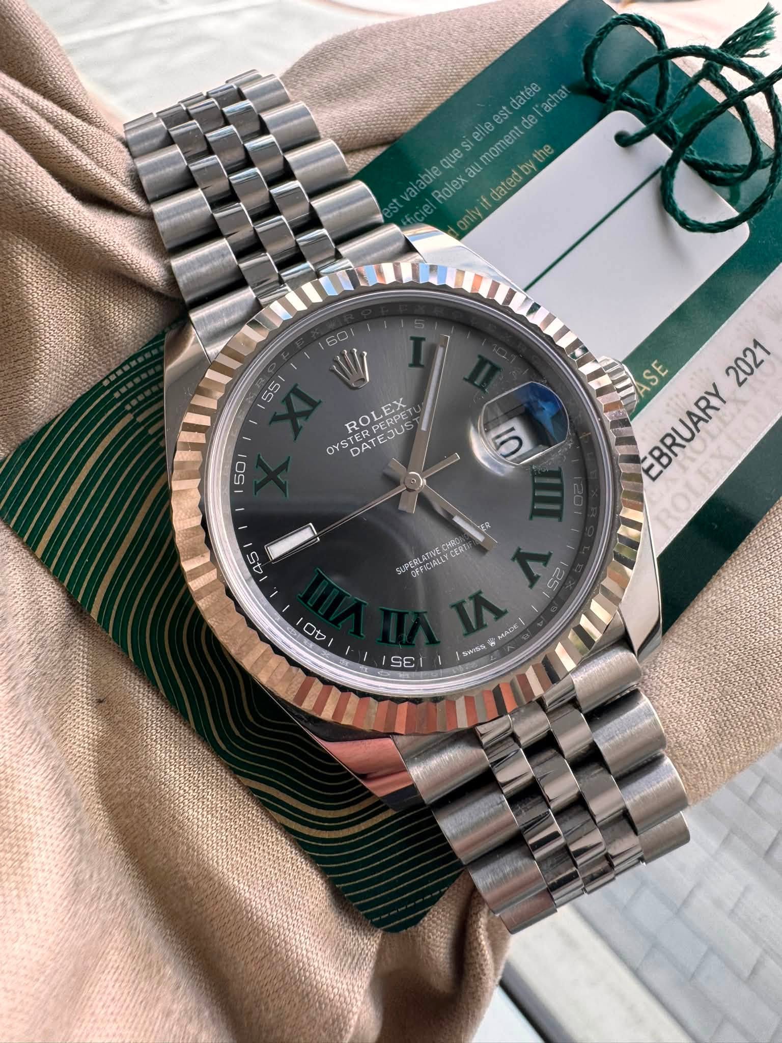 May be an image of wrist watch and text