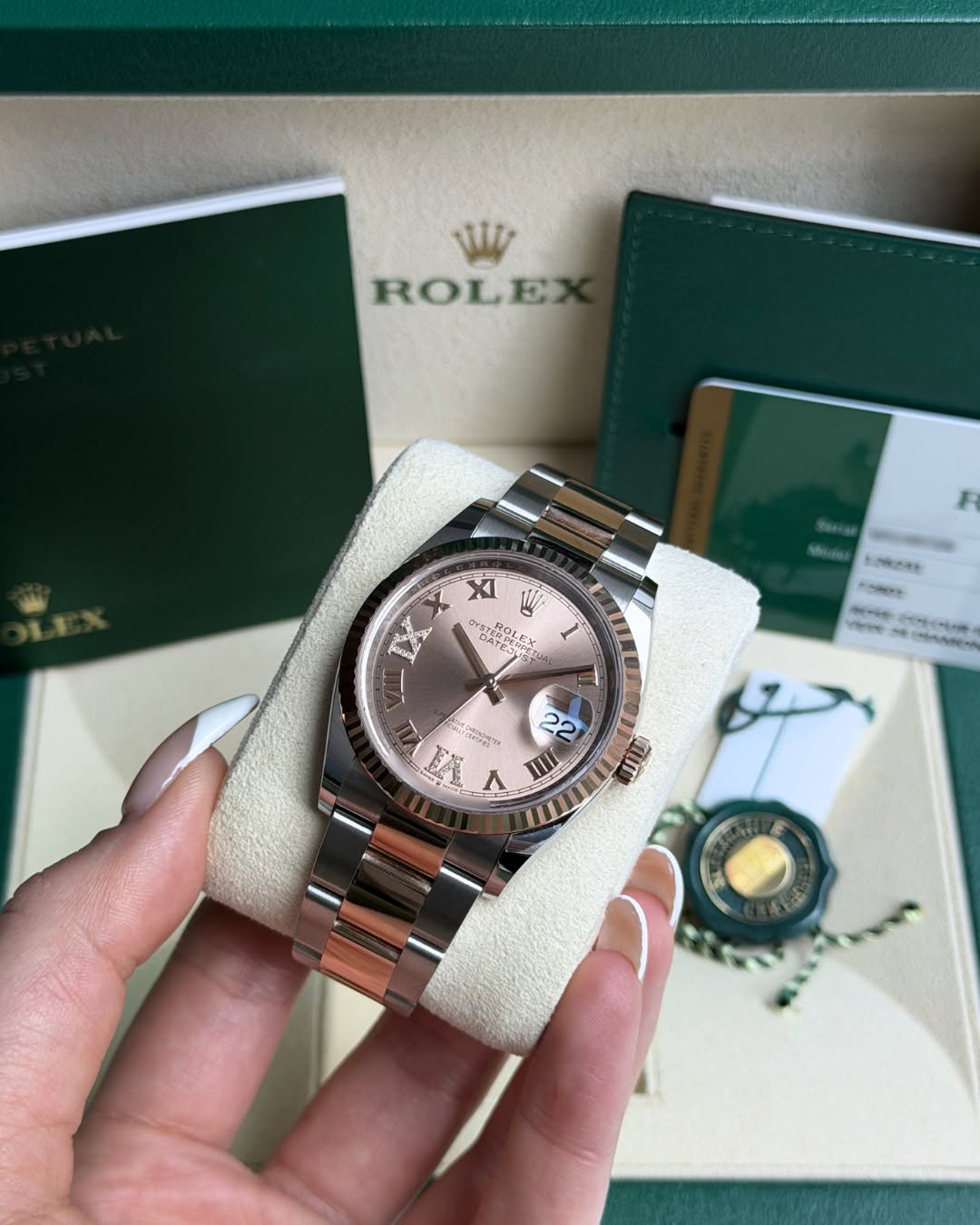 May be an image of wrist watch and text