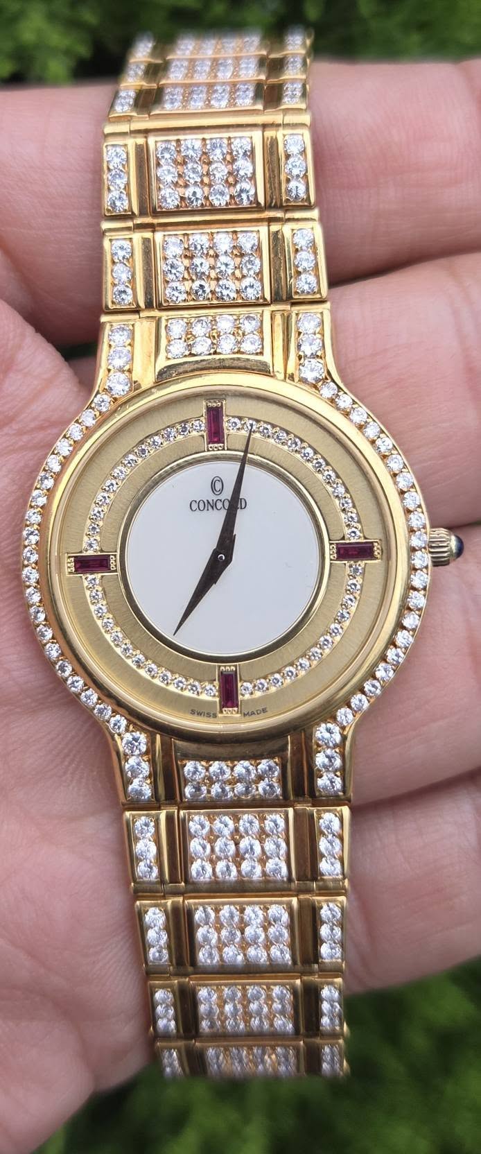 May be an image of wrist watch and text
