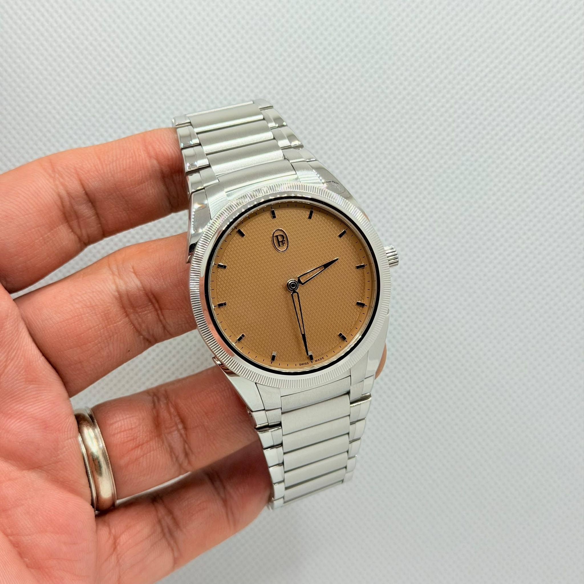 May be an image of wrist watch and text