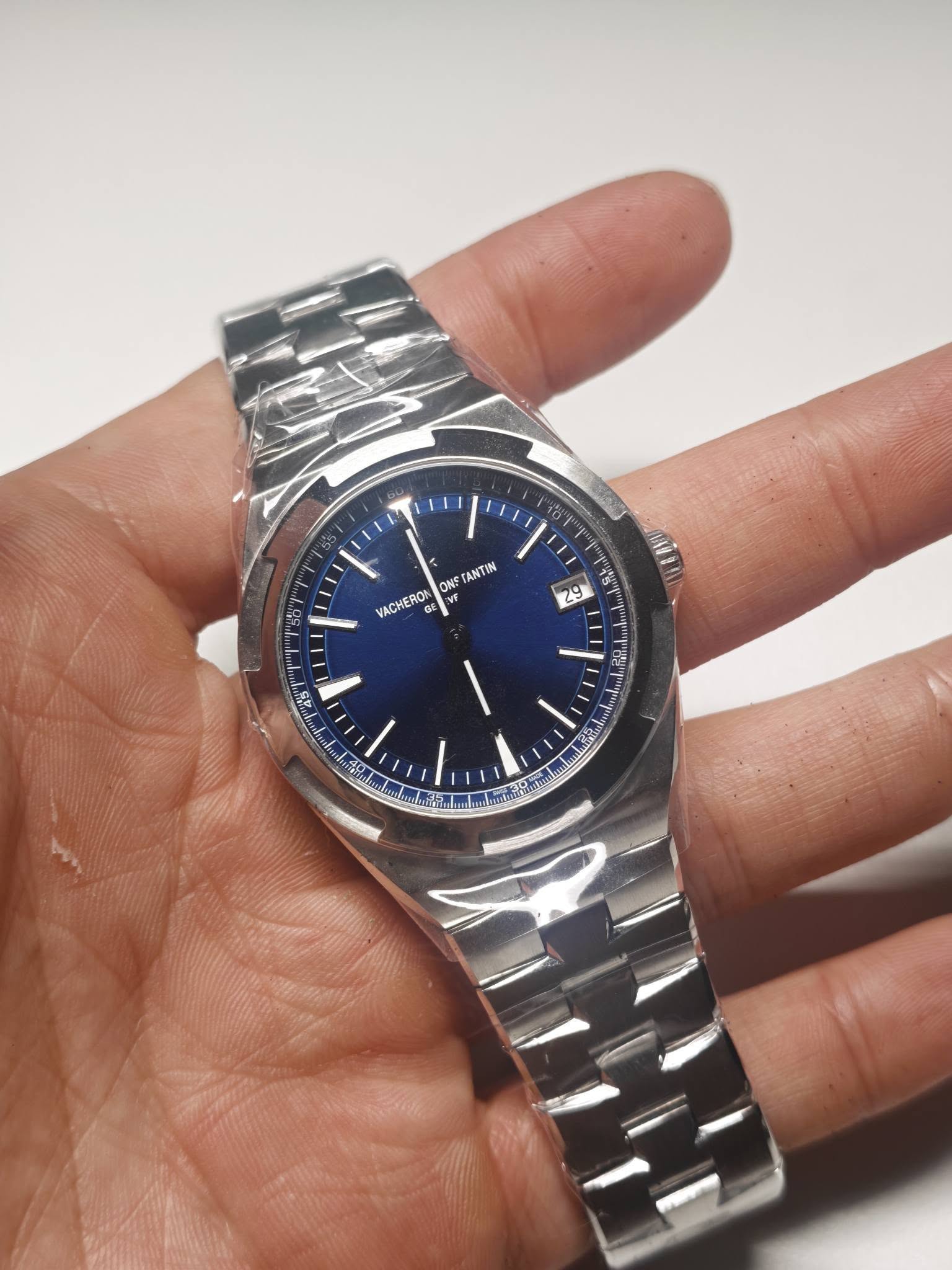 May be an image of wrist watch and text