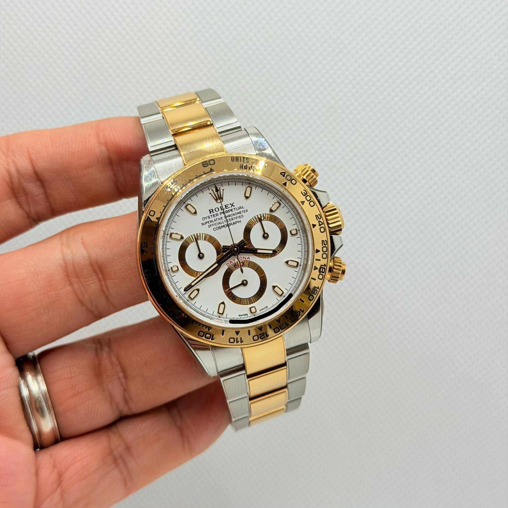 May be an image of wrist watch and text