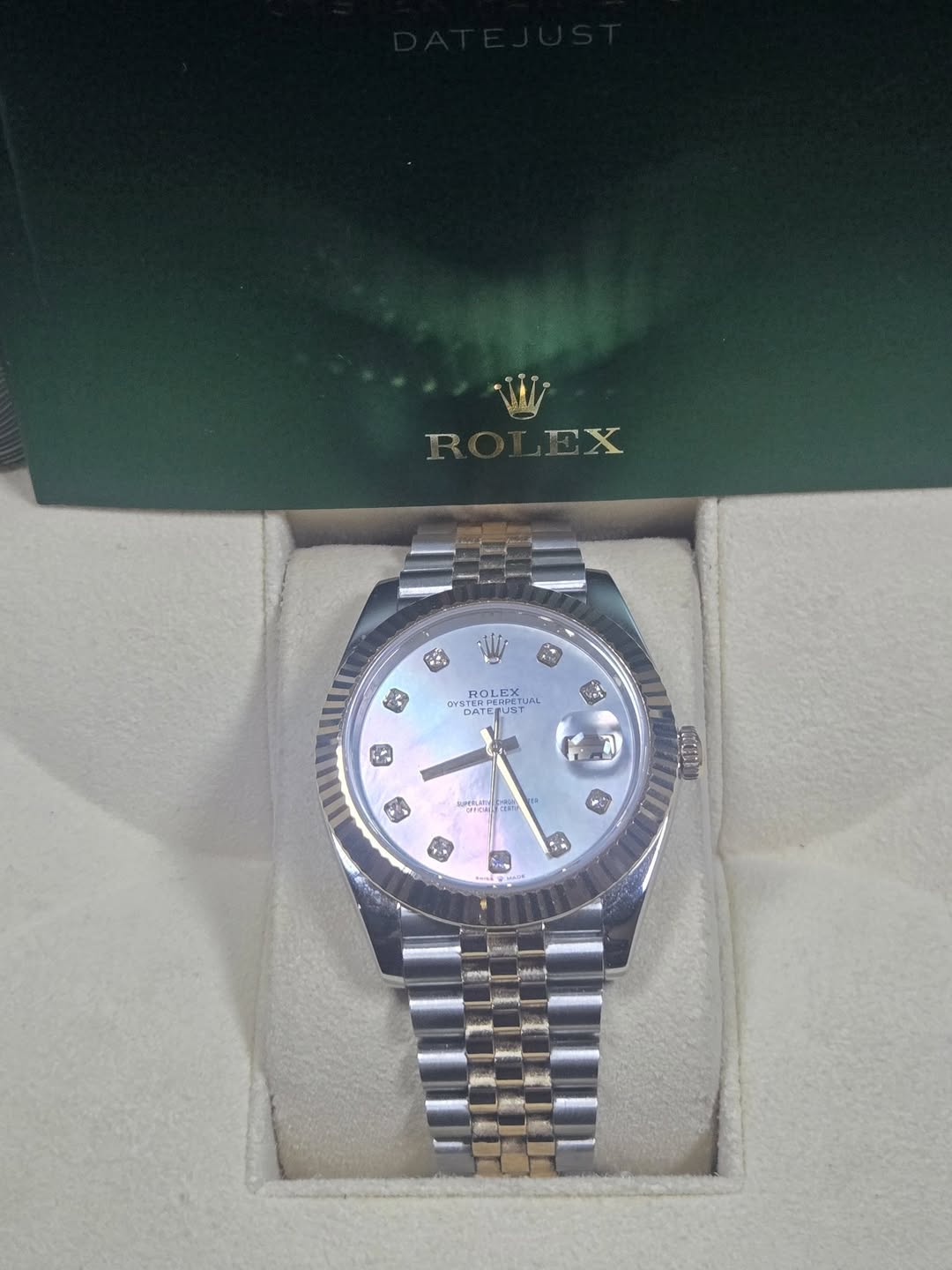 May be an image of wrist watch and text
