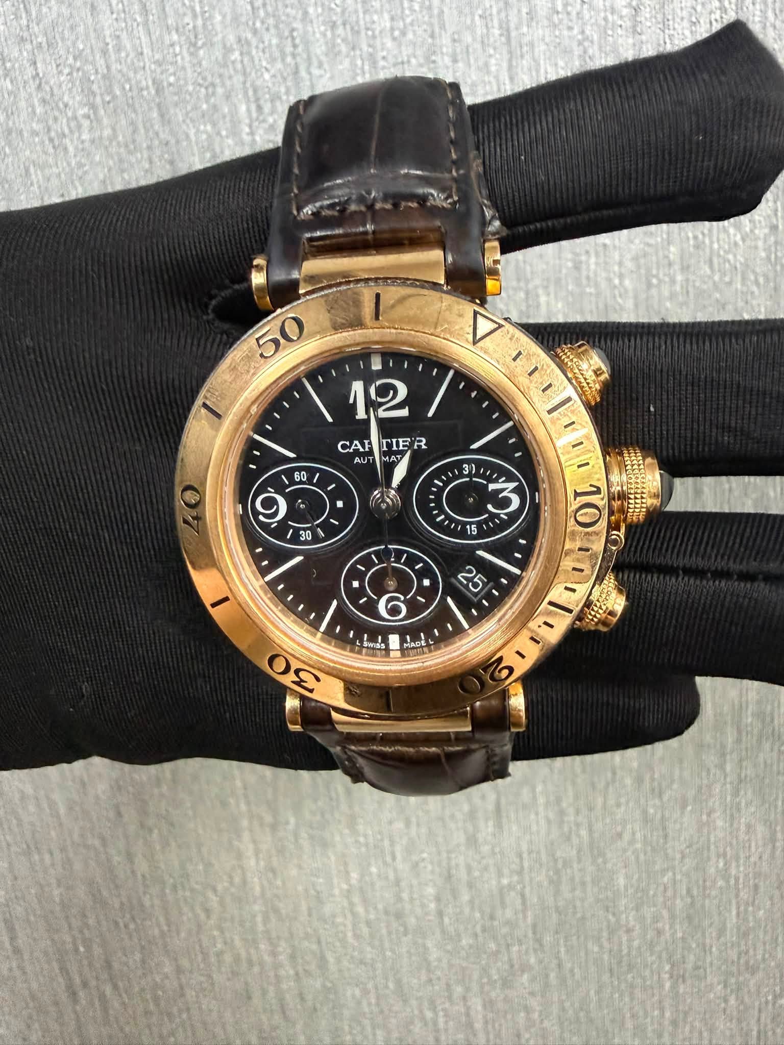 May be an image of wrist watch and text