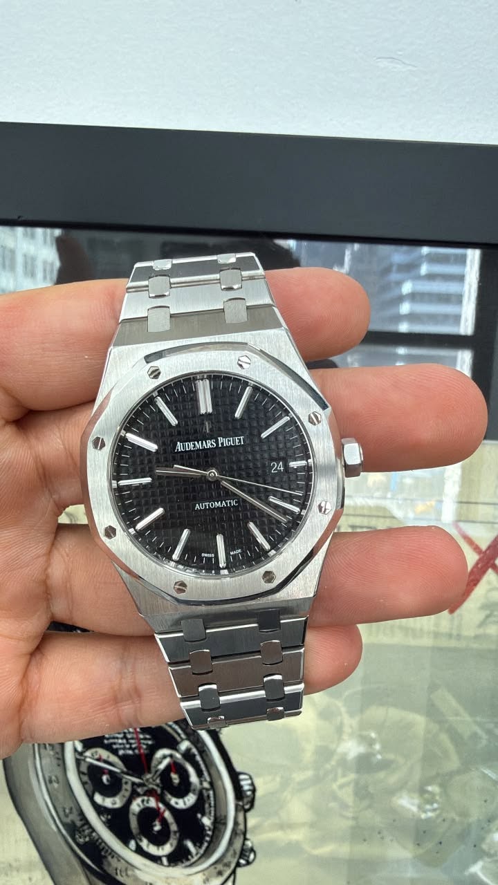May be an image of wrist watch and text