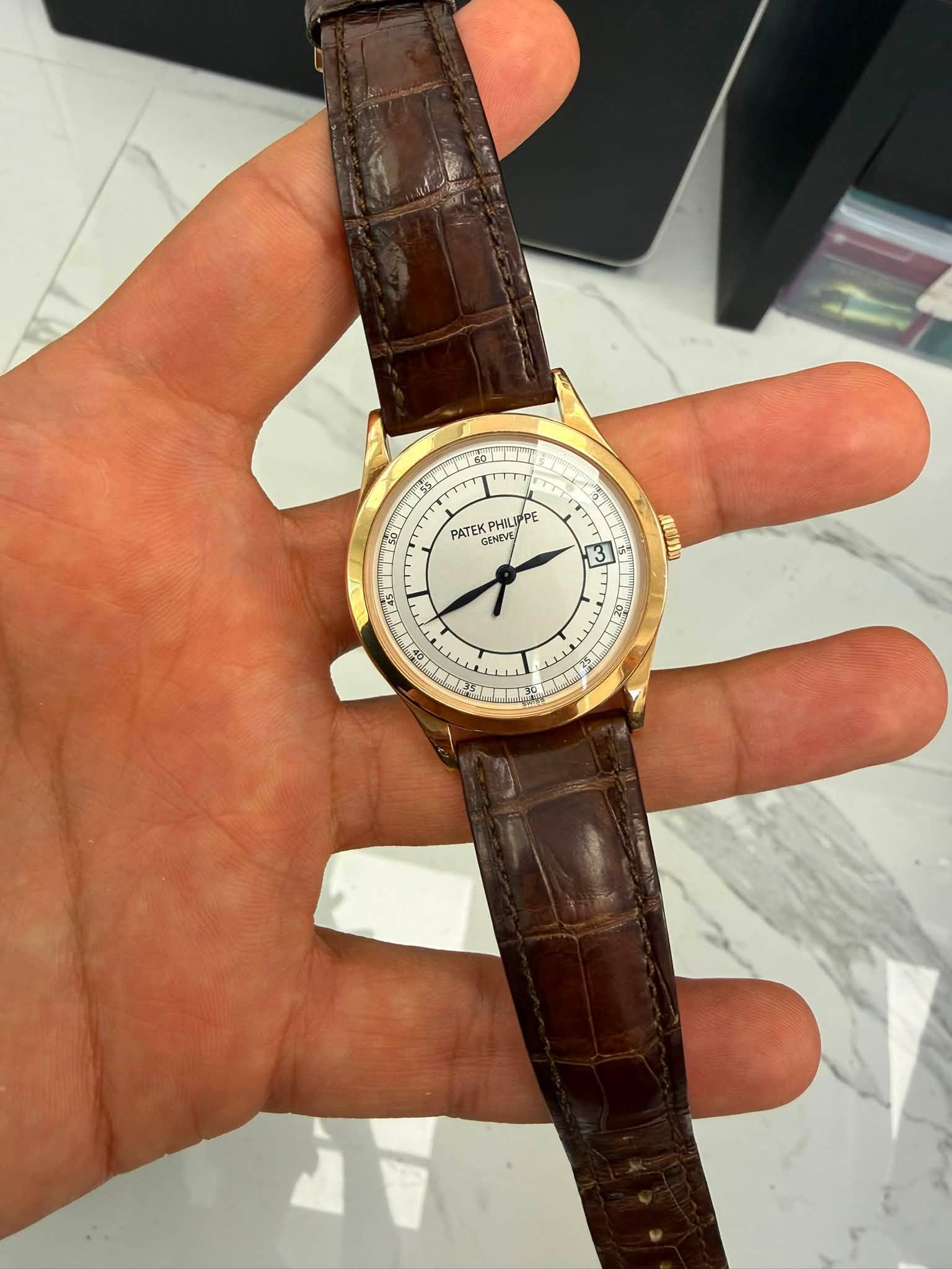 May be an image of wrist watch and text
