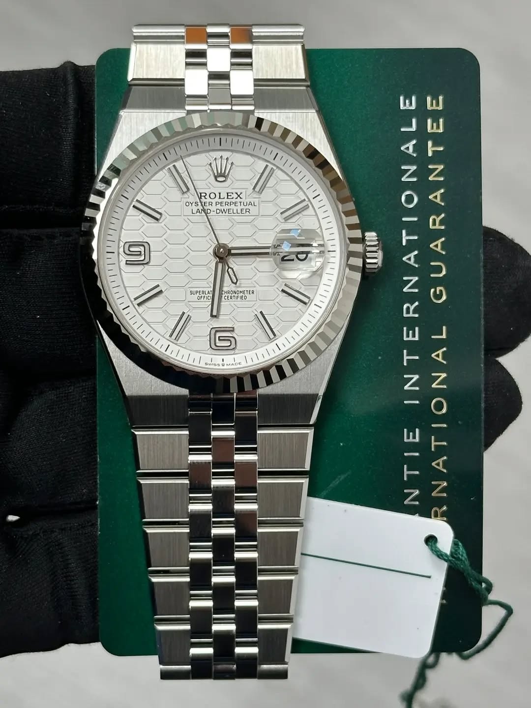 May be an image of wrist watch and text that says 'W ROLEX OYS OYSTER OYSTERP ERPETUA JAL LAND DWELLER TUAL ER ១ 1 SUPERLAT OEFIC RONGMETER TER CERTIFIED CROMOMETE បា WЛи…
