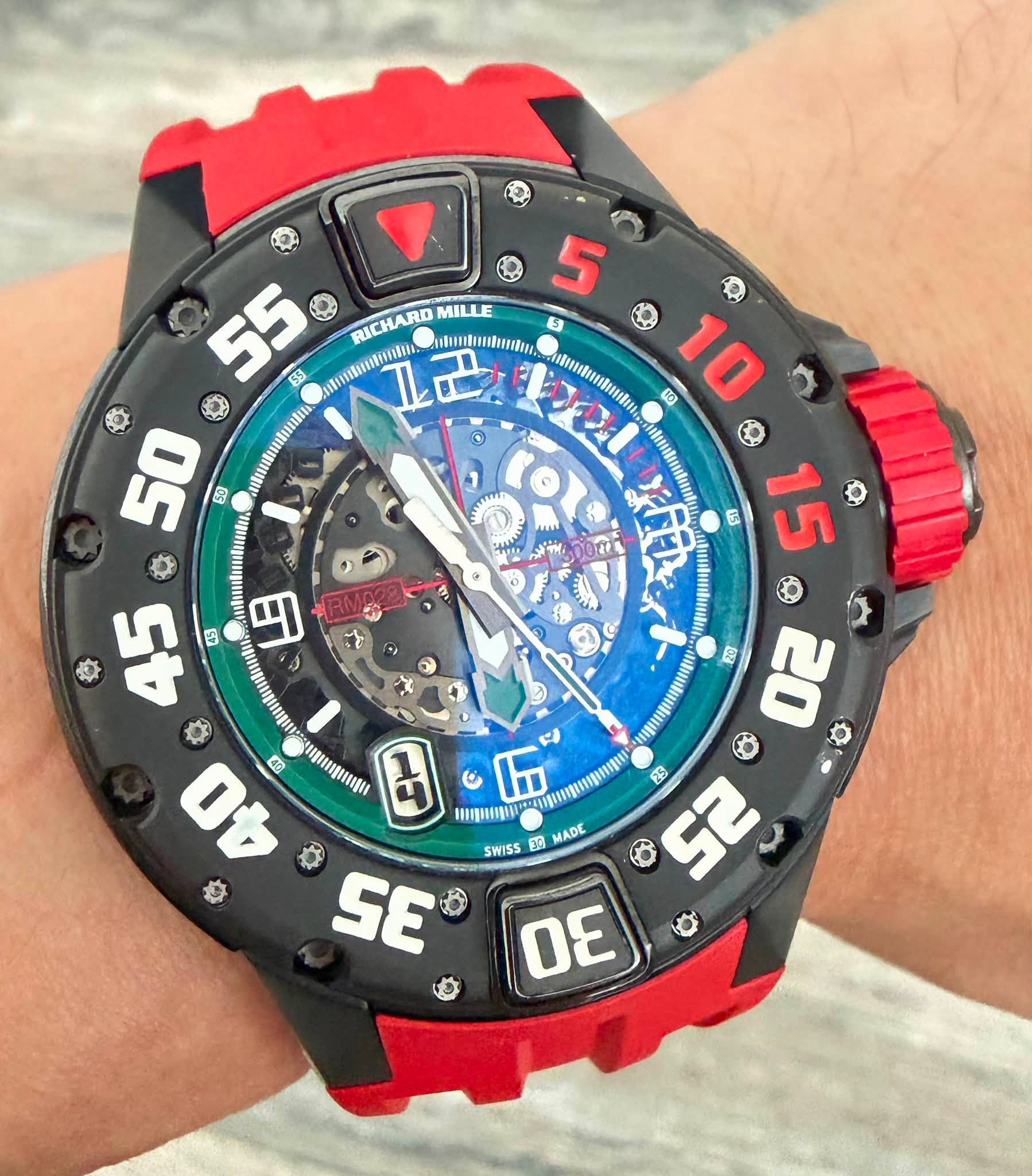 May be an image of wrist watch and text