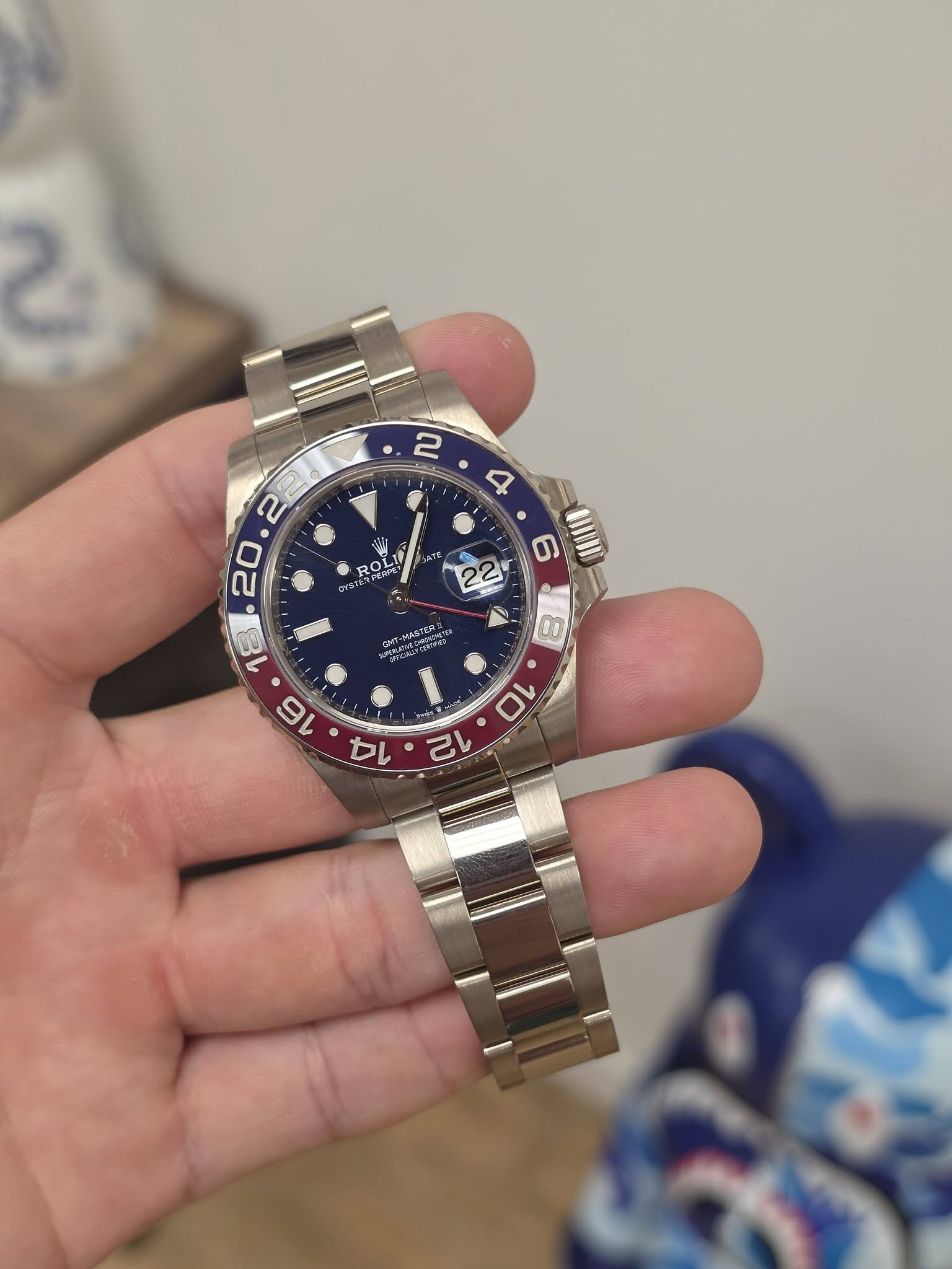 May be an image of wrist watch and text