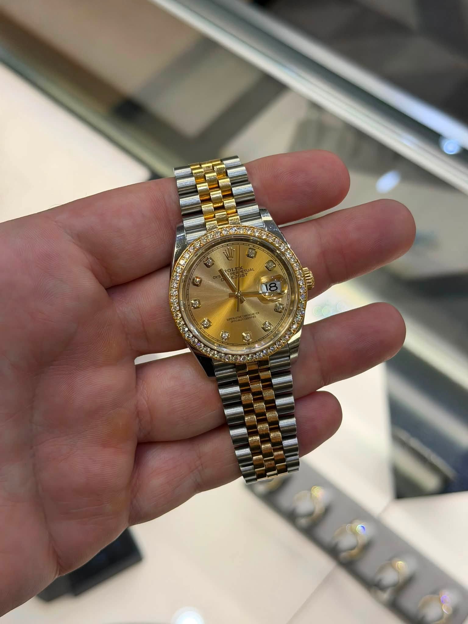 May be an image of wrist watch and text