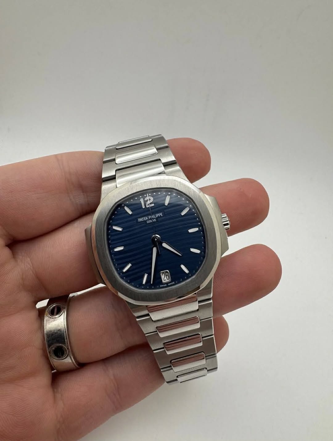 May be an image of wrist watch and text