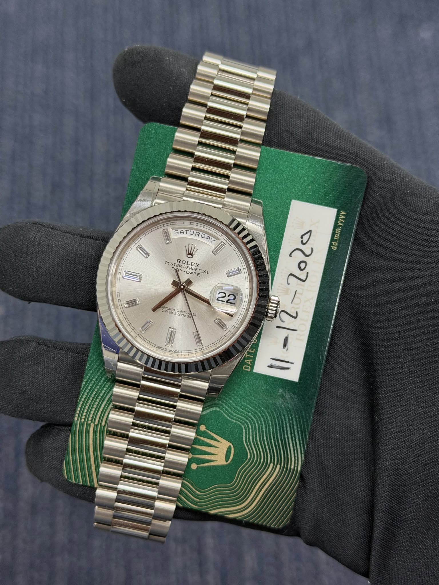 May be an image of wrist watch and text