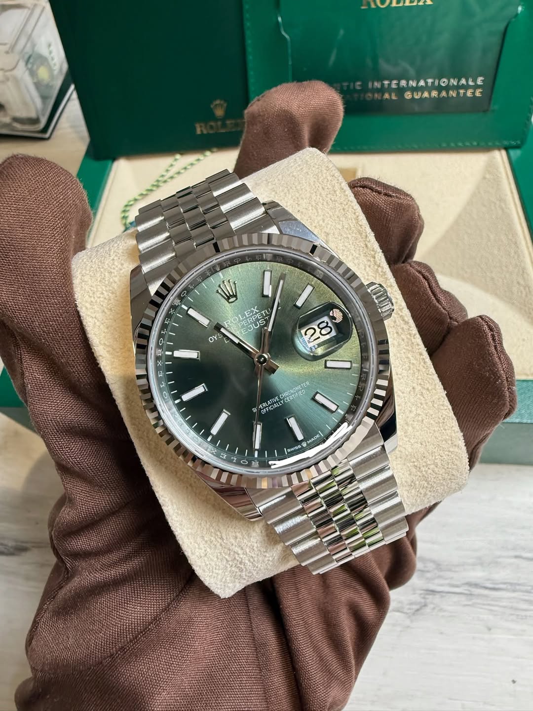 May be an image of wrist watch and text