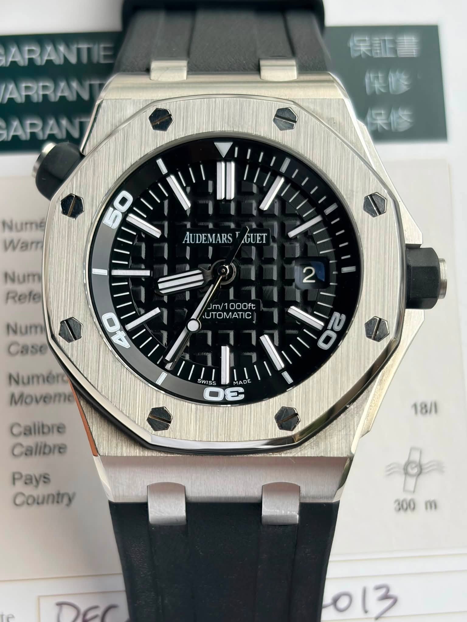 May be an image of wrist watch and text that says 'ARANTI ARRANT ARAN ARAN 保証書 傑修 笑修 Numé Warr AUDEMARS AUDEMARS.GUET GUET Num Refe 2 Num Case Jm/1000ft UTOMATIC Numero Movemo 00…