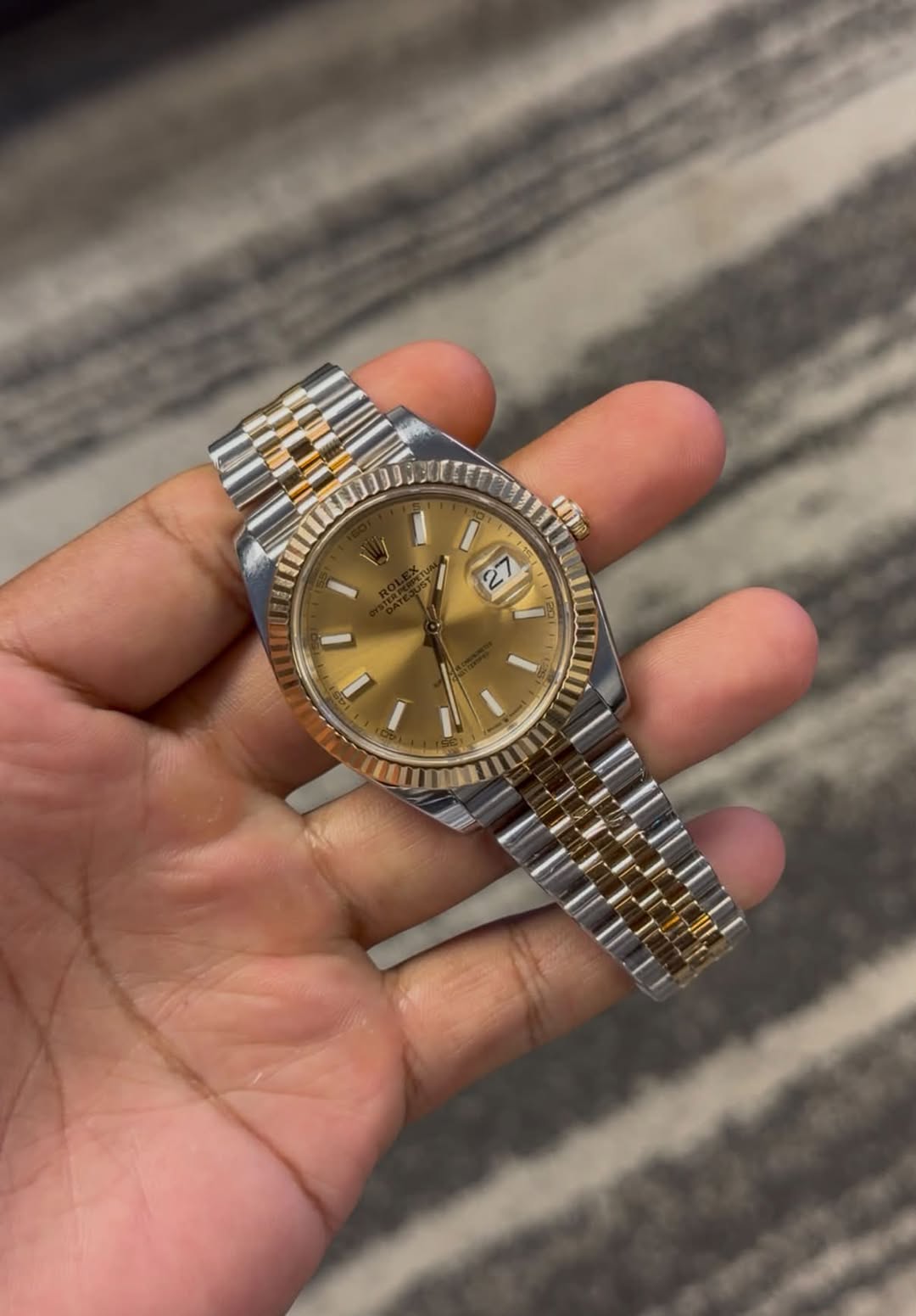 May be an image of wrist watch and text
