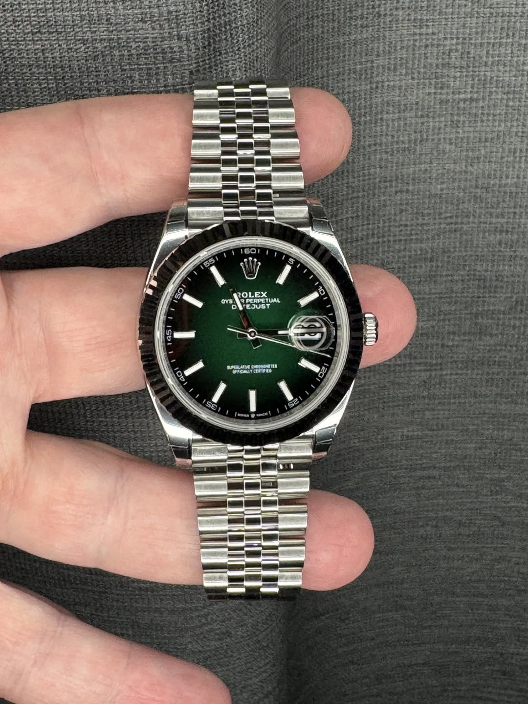 May be an image of wrist watch and text