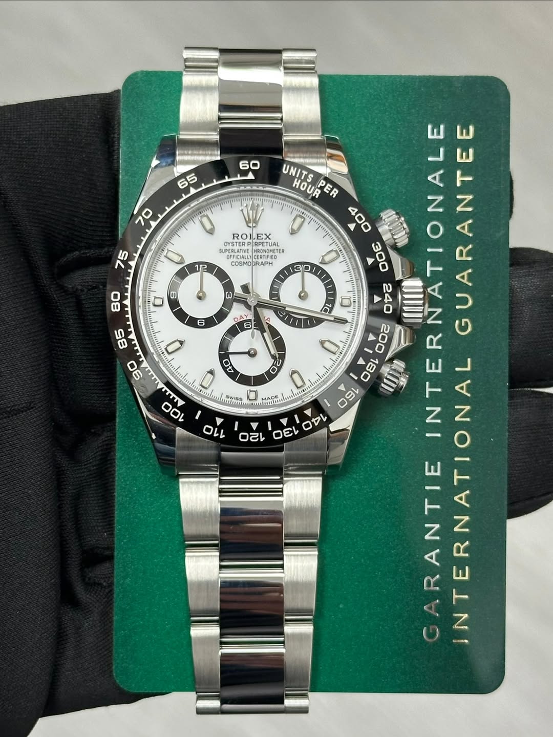 May be an image of wrist watch and text that says '60 65 70 ROLEX 75 SUPERLATIE UPEBLATNE ANTE MnOMOMETEЙ COSMOCRAPH RAPH 12 30 80 O ผ 6 AY รย 100 O UNITS HOUR 1C N E A A ARANTIE…