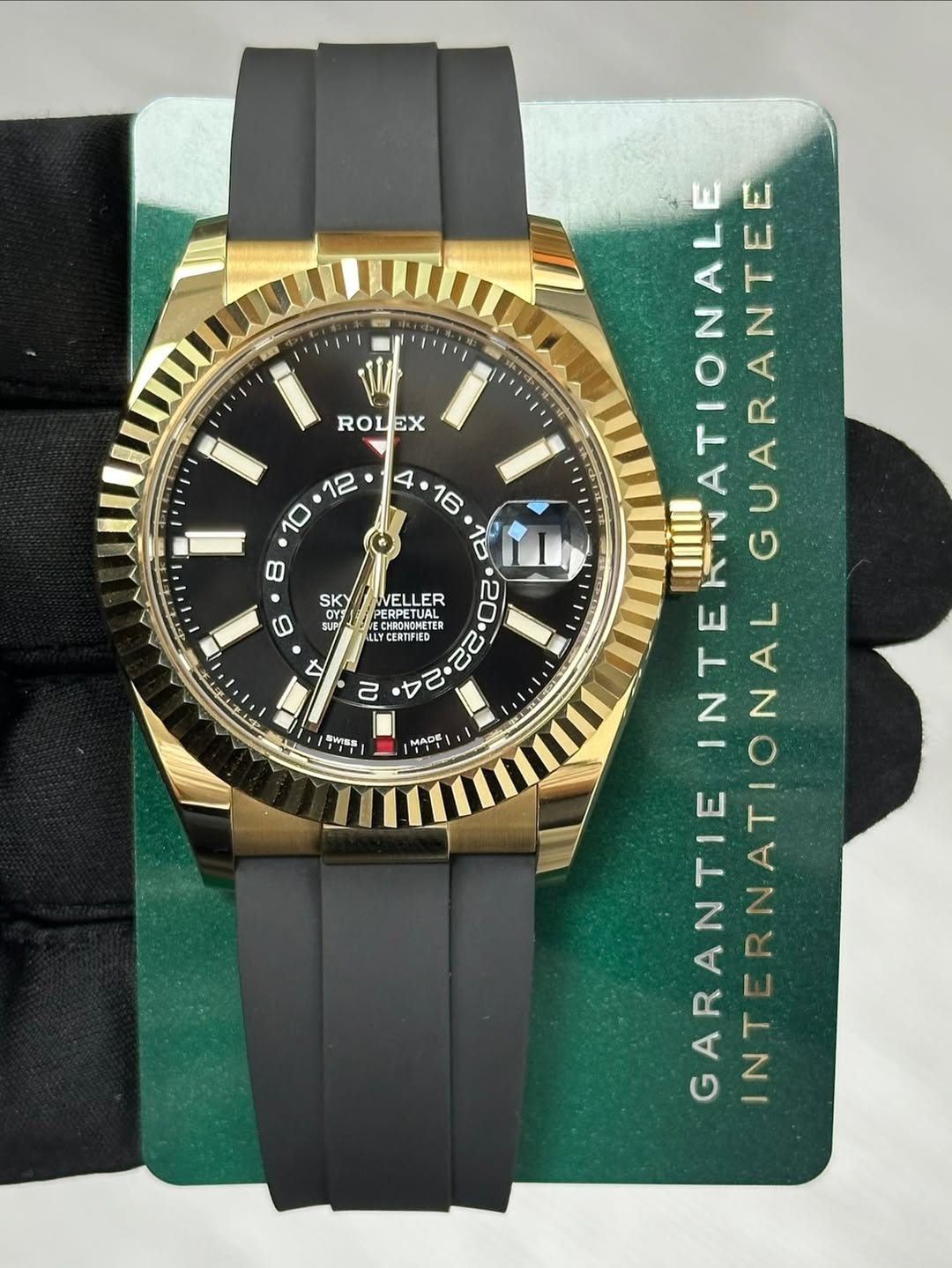 May be an image of wrist watch and text that says '23 ROL EX SKY 0 SUPI X VELLER PERPETUAL HACAL CERTIFIED 22 i 4 2 SWsS MADE INTEAWATIONAL ATIONAL IIIL ١٧ GUARANTEE INTERNATIONA…