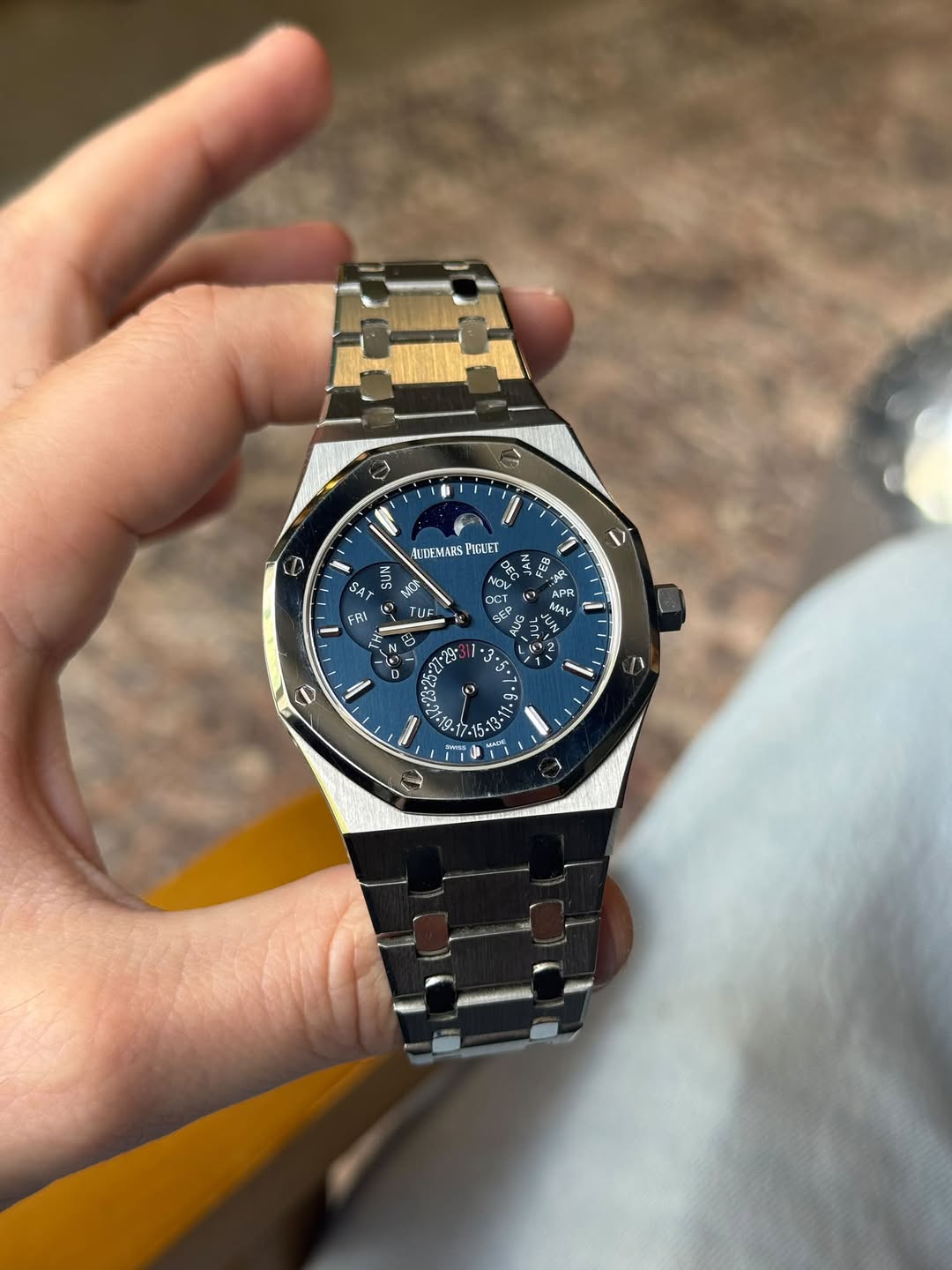 May be an image of wrist watch and text
