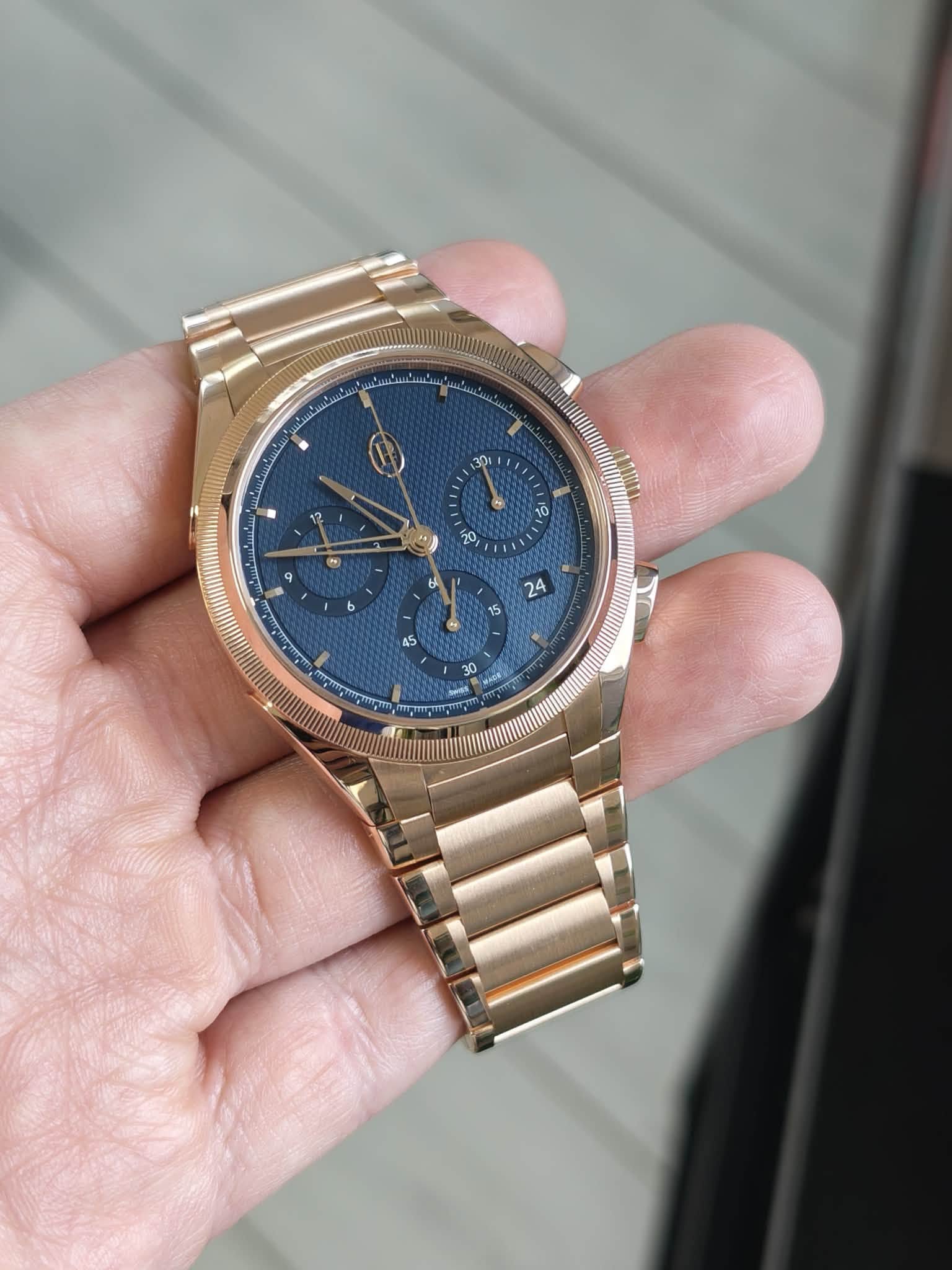 May be an image of wrist watch and text