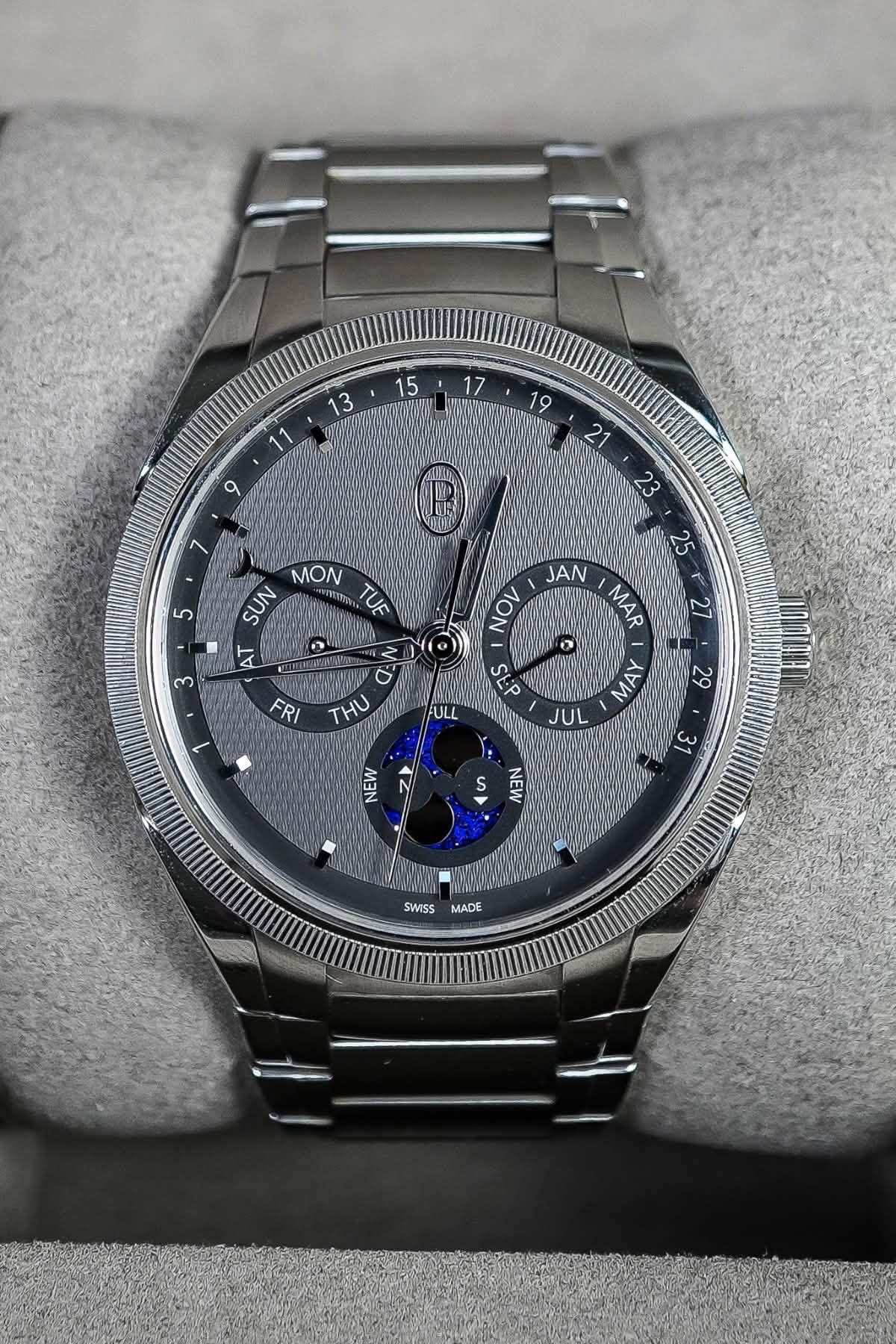May be an image of wrist watch and text that says ' E 5 MON SUN TUE AT 0 3 N 0 27 25 ٨AJ MAR Νν 7S AW JUL - FRI THU 1 ULL 29 EU NEW 31 ی NEN SWISS MADE'