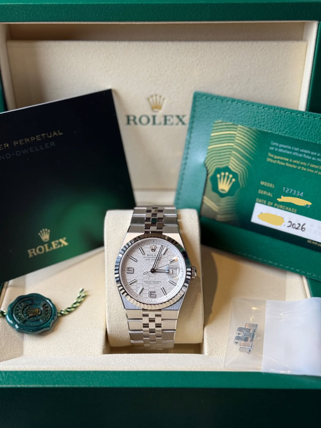 May be an image of wrist watch and text